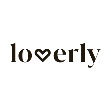 The word 'lovely' written in black lowercase letters with a heart shape replacing the letter 'v'.