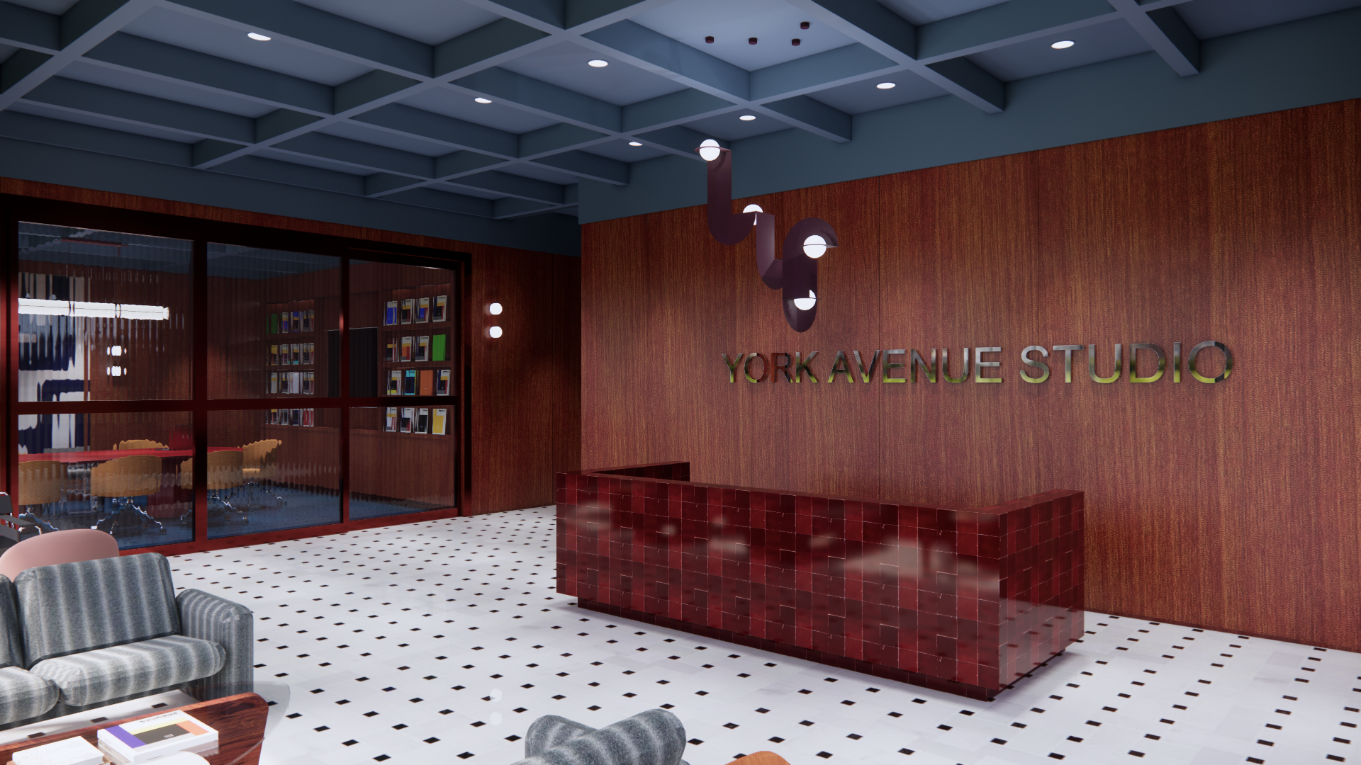 Lobby of York Avenue Studio with a reception desk, reading chairs, and a wall with the studio's name. There is a glass room with chairs and bookshelves visible through the glass.