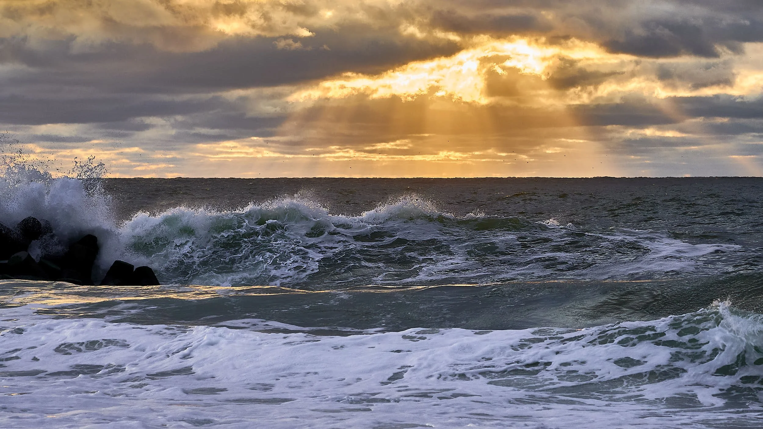 Dark sky, god rays, rough water Pt Pleasant, NJ