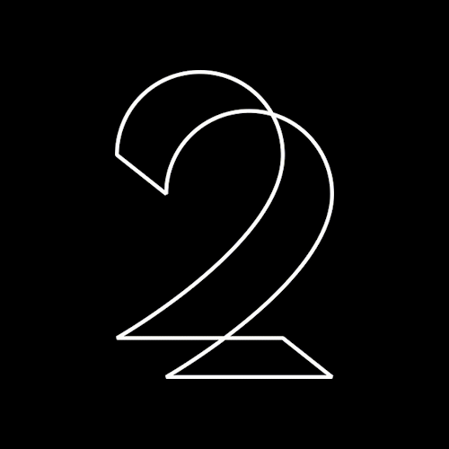 Abstract black, white, and gray geometric shapes arranged in a pattern.