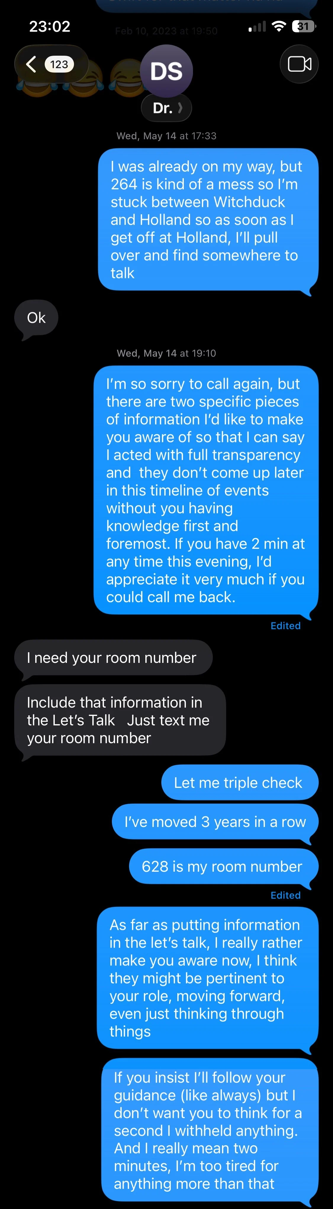 Text message conversation on a phone screen discussing room numbers and event details.