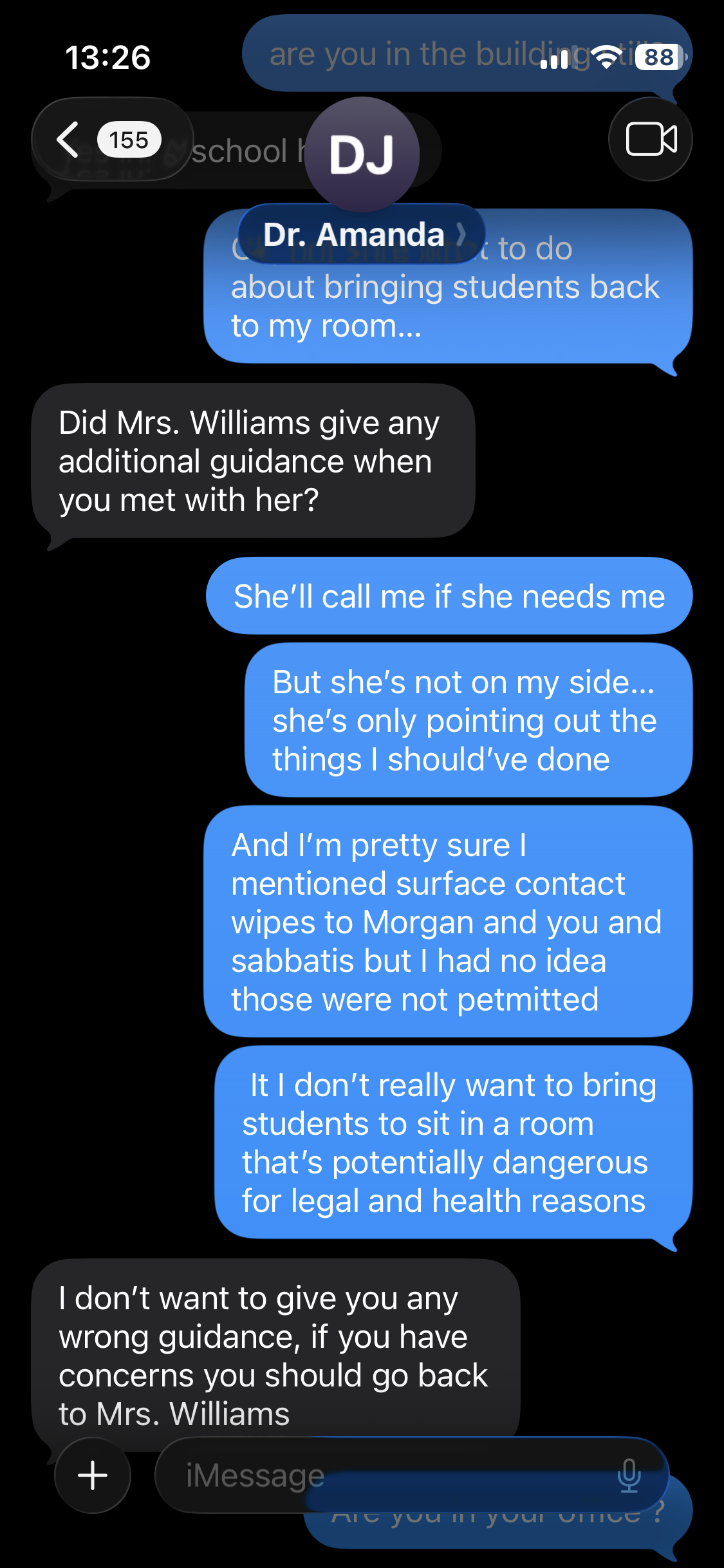 Screenshot of a text message conversation between a teacher and a colleague about guiding students on room arrangements and health protocols.