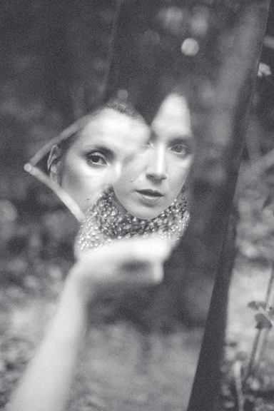 A plain, dark gray, textured surface.