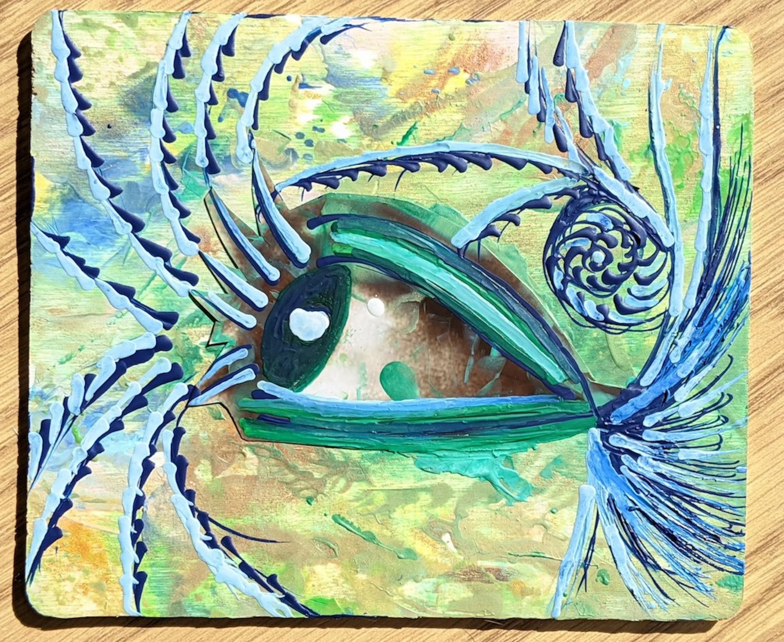 Abstract painting of a pharaoh's eye with vibrant green and blue hues, surrounded by swirling patterns and textured brushstrokes.