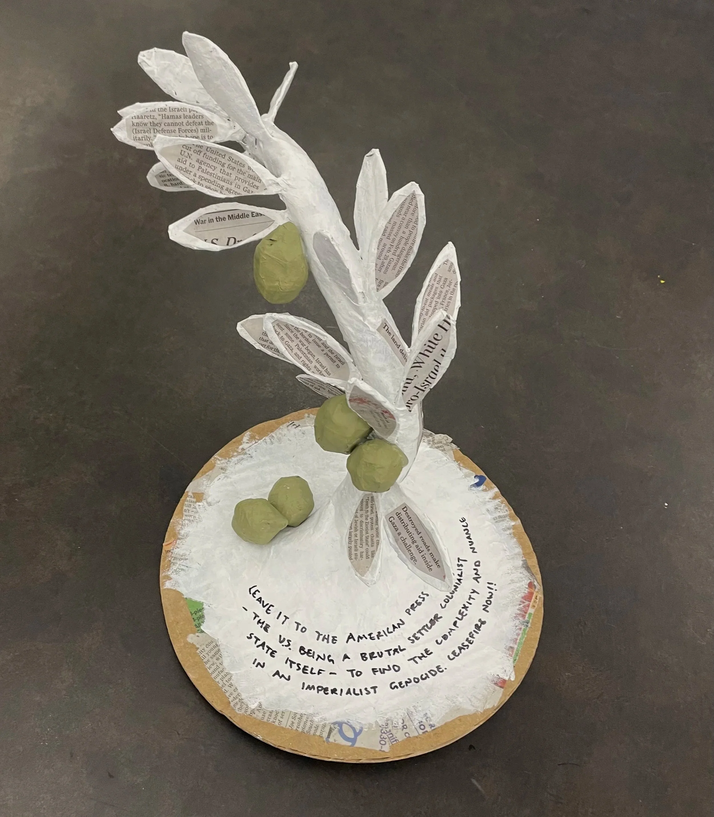 "Olive Branch," news paper, paper mache, acrylic, styrofoam, 2024. 