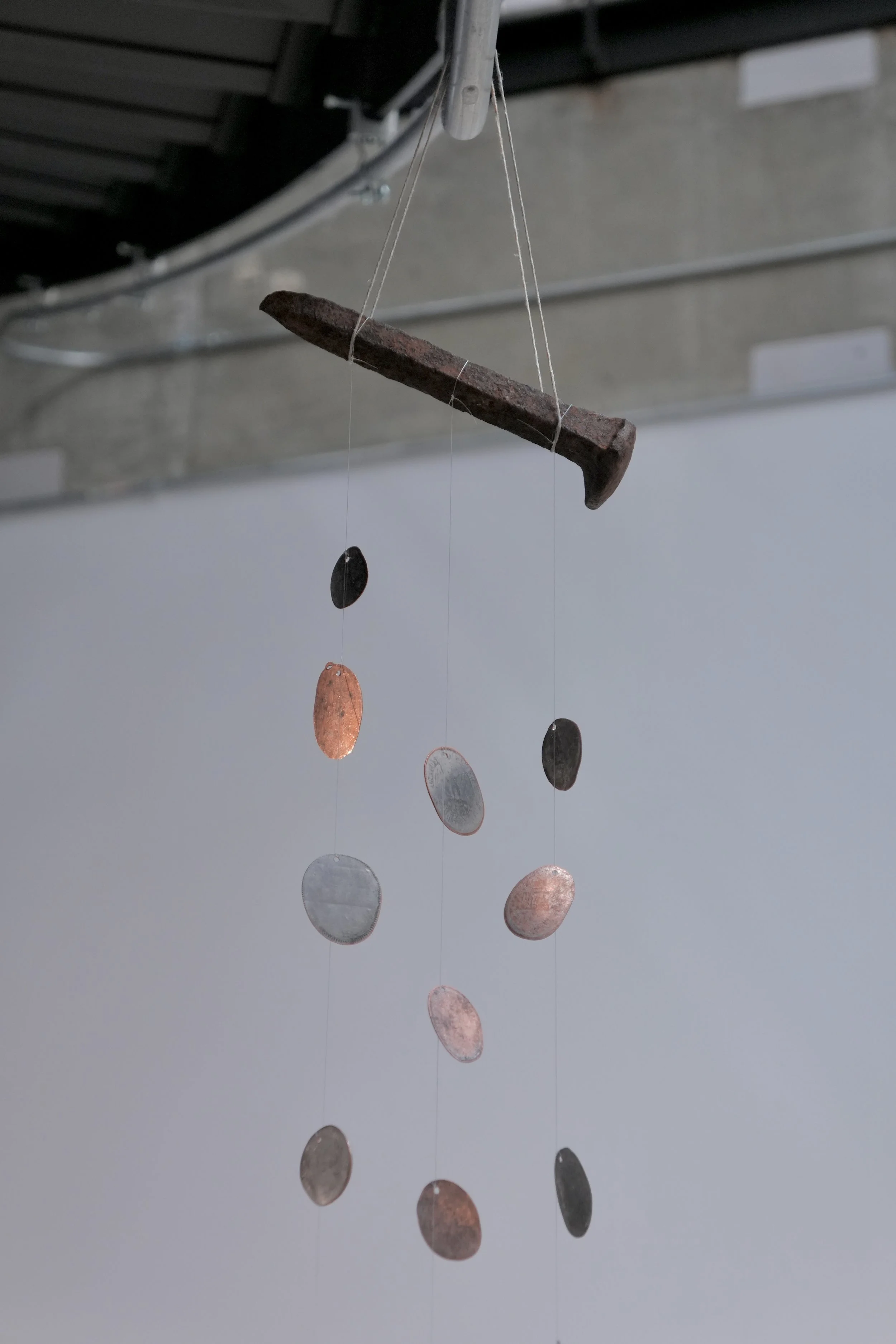 Chime, rail tie spike and flattened coins, 9"x3"x"60", 2025.