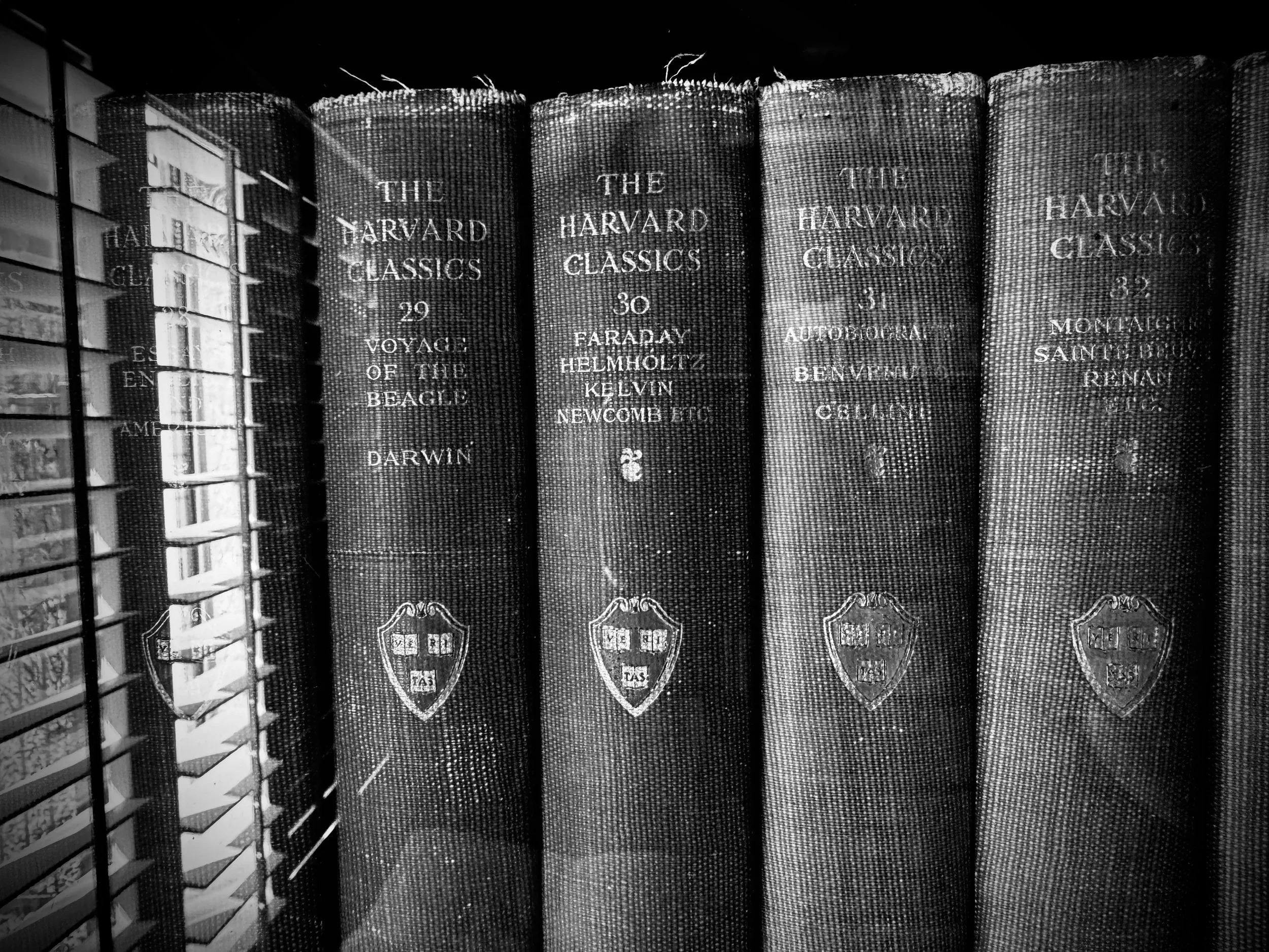 Black and white photo of "The Harvard Classics" books.