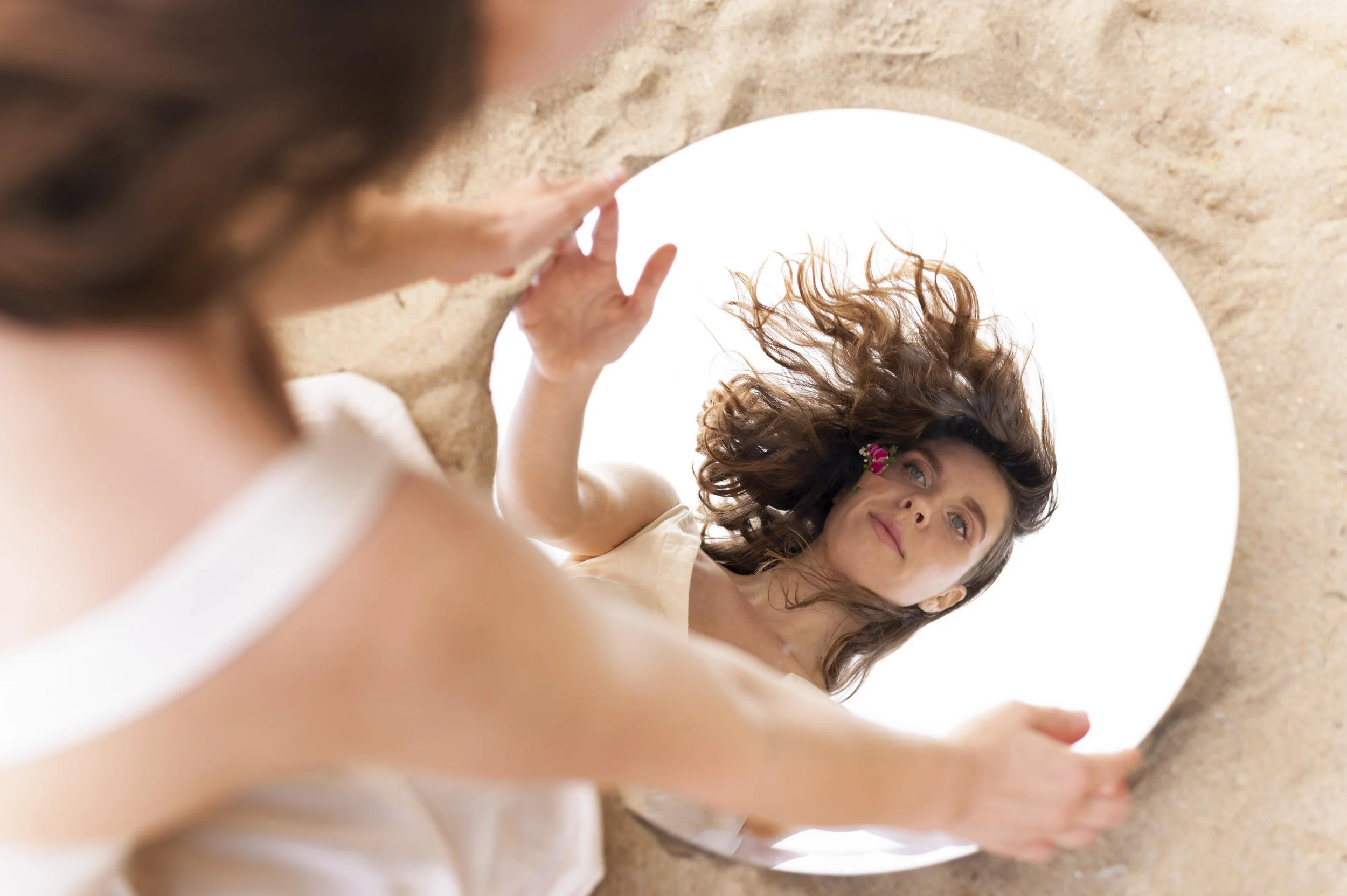 portrait-young-woman-posing-confidently-outdoors-with-round-mirror.jpg
