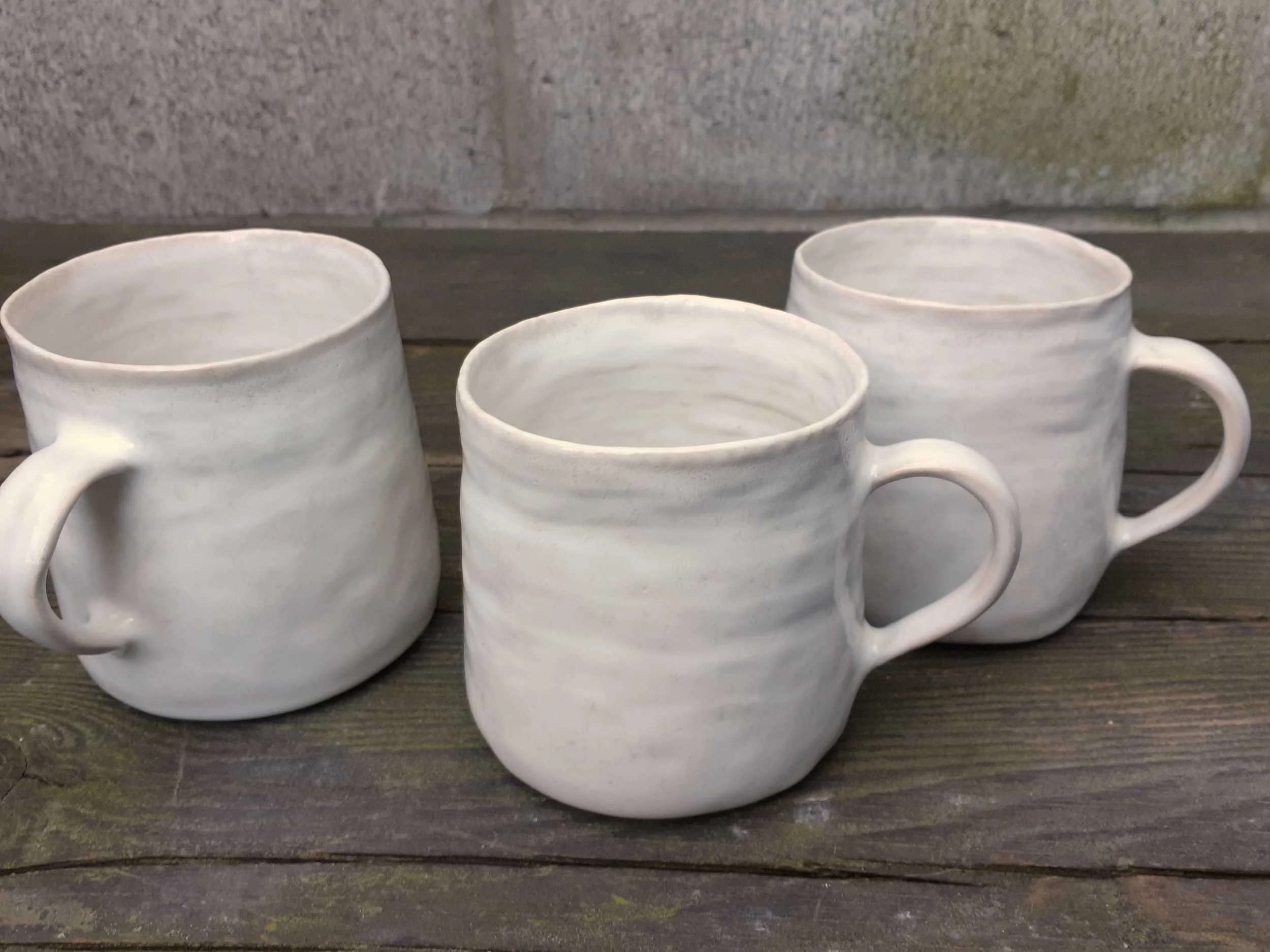 Coiled Mugs, White. Porcelain. Dimensions approx 12.5cm W x 9.5cm H x 9.5cm D.