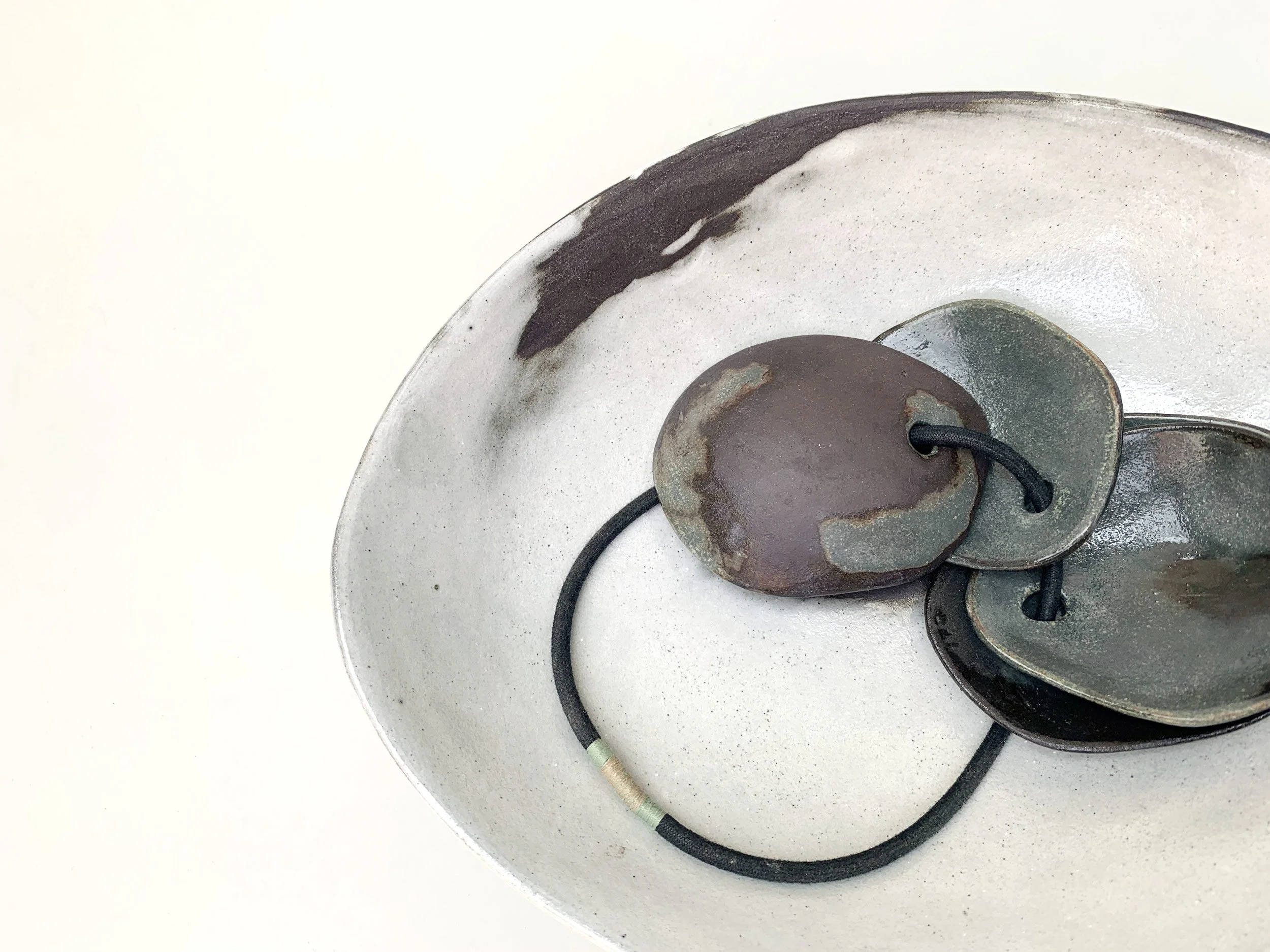 Keychain, detail. Stoneware, cord, thread. 26cm L x 20cm D x 2.5cm H