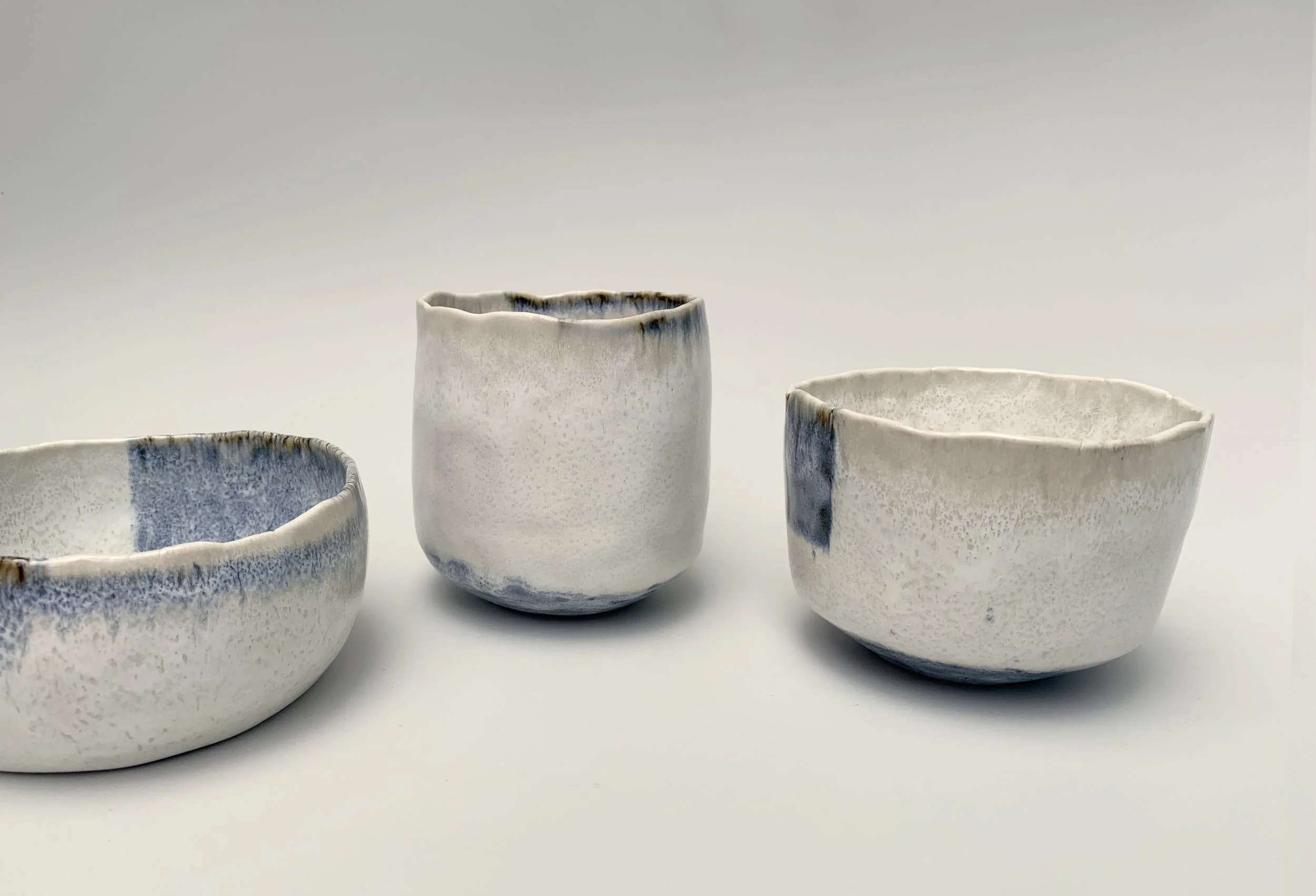 Pinch Pots 5, 8,9. Porcelain. Middle: 10cm W x 10cm H x 9.5cm D, Right: 11.5cm W x 8cm H x 10cm D.