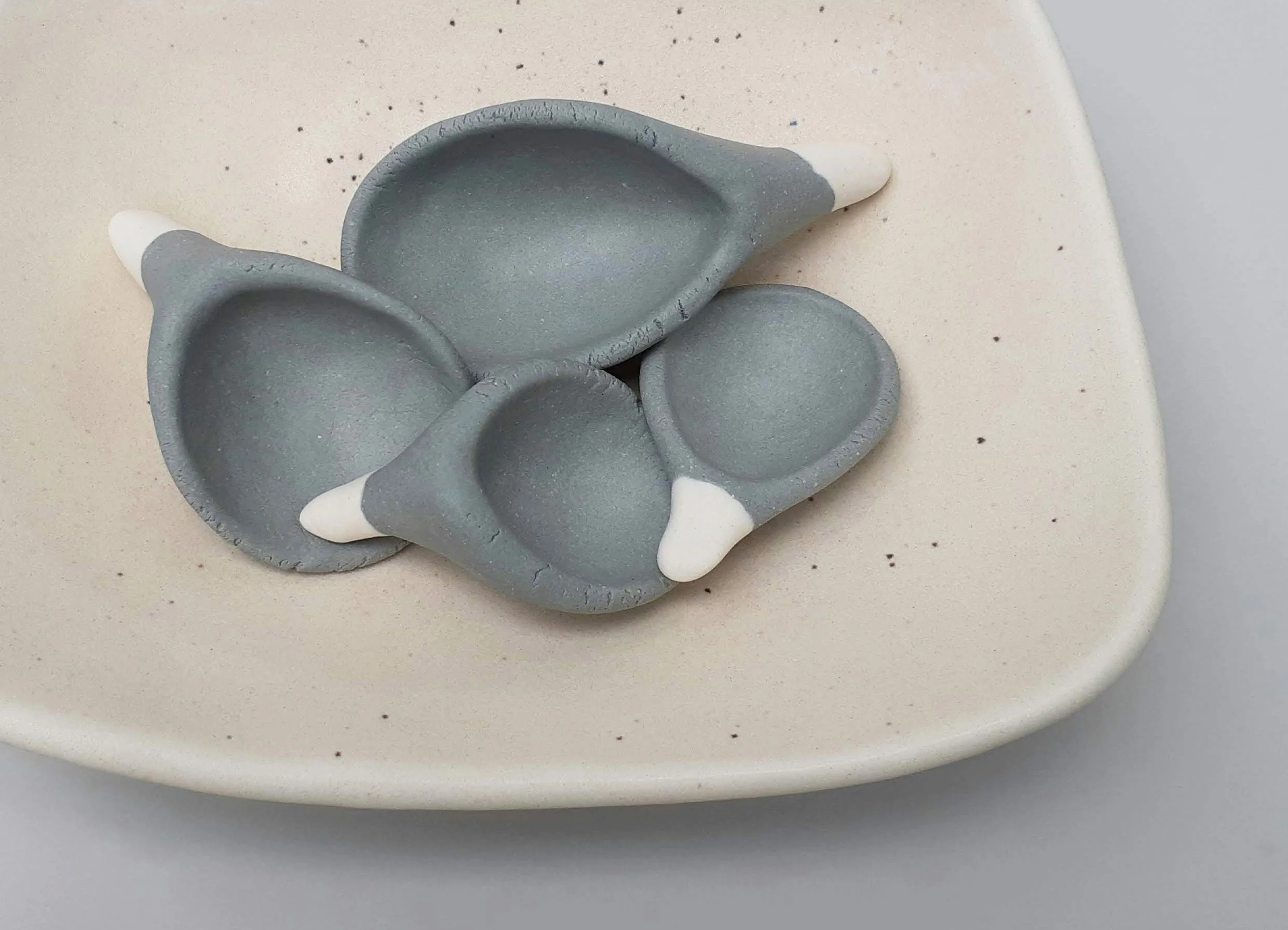 4 Spoons. Porcelain. 19.5cm L x 15.5cm D x 1.5cm H