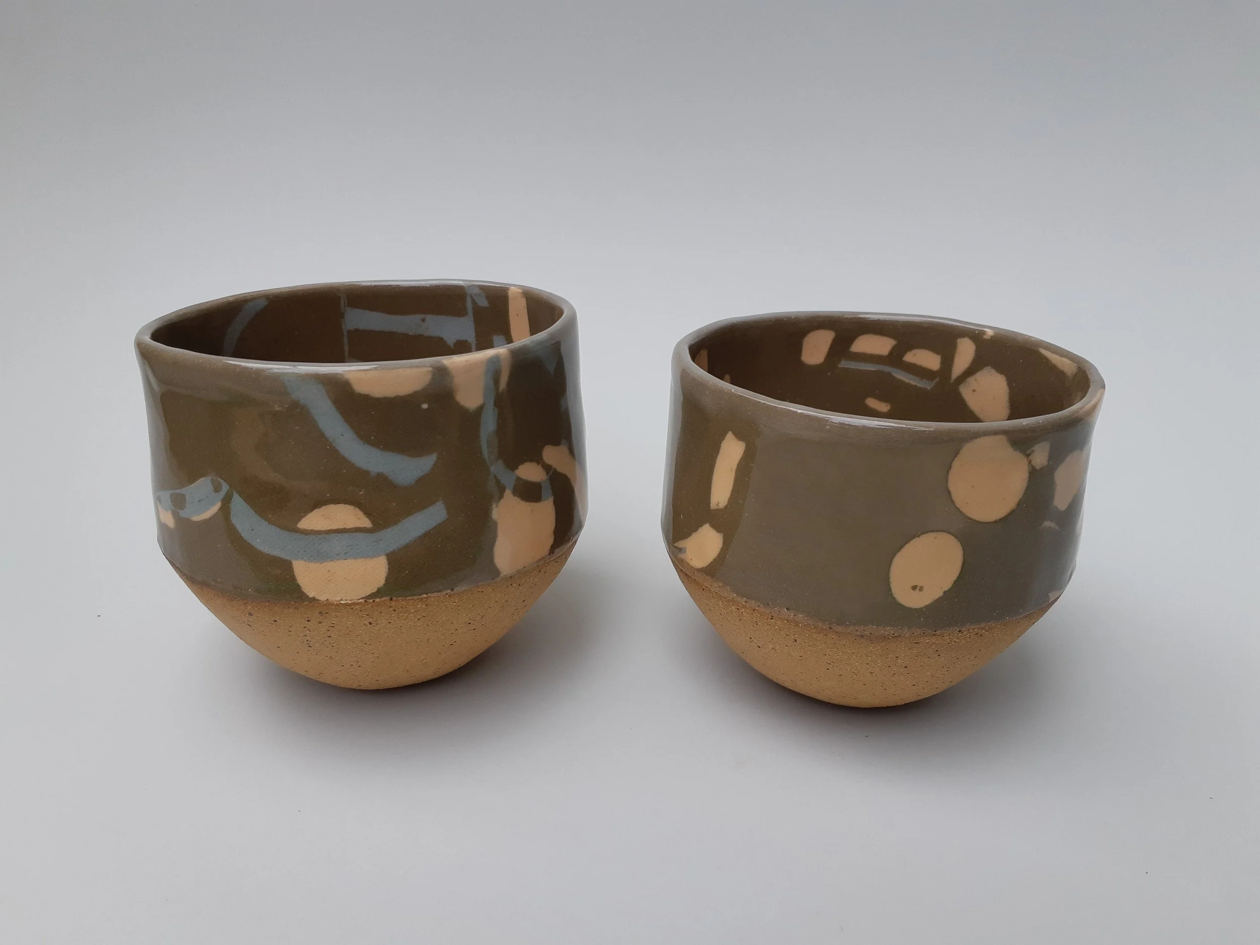 Coloured Clay Small Planters. Stoneware. Left 9.5cm W x 8cm H x 9cm D, Right 9cm W x 8cm H x 9cm D.