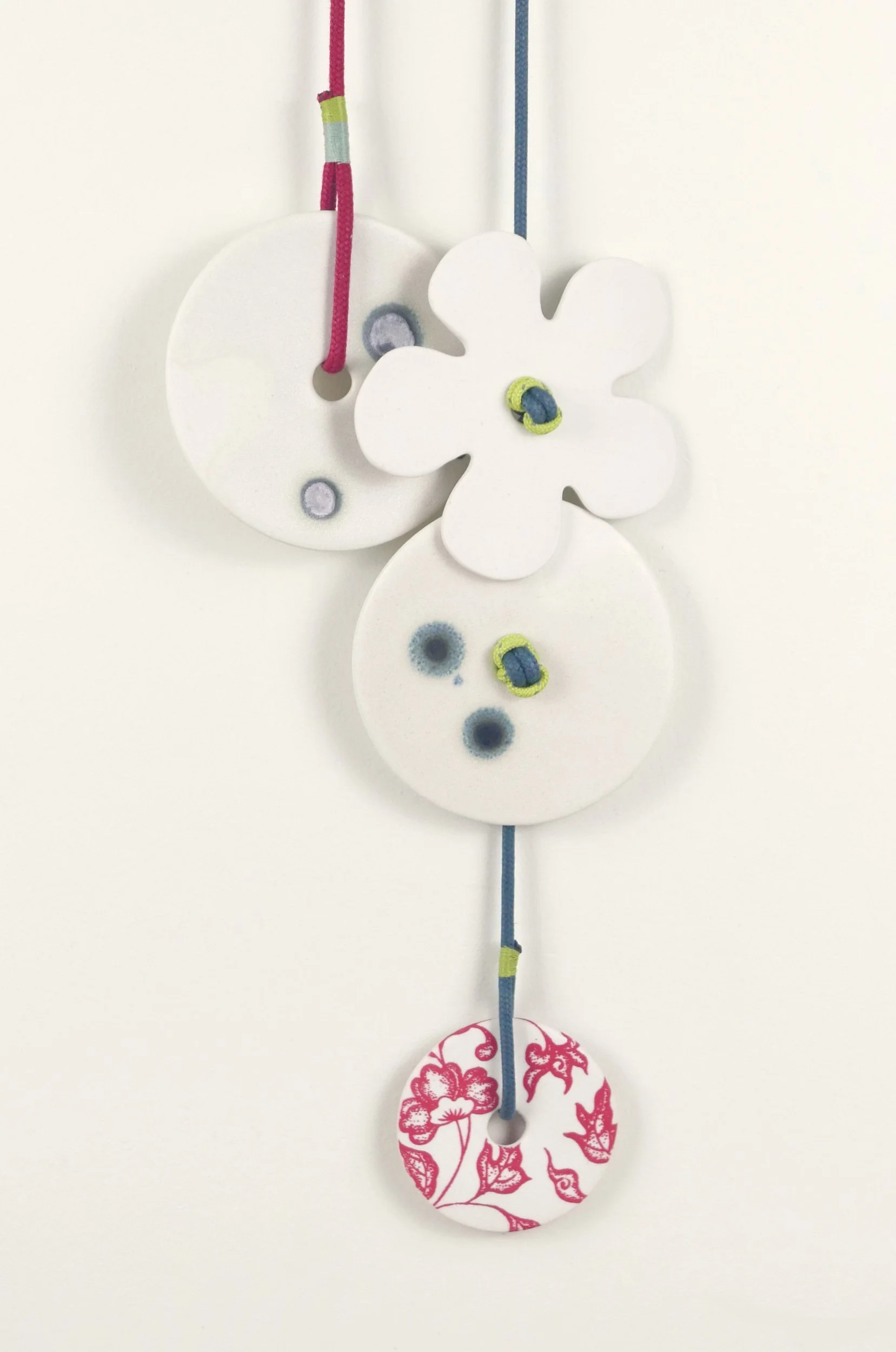 Flora 7. Porcelain, ceramic decals, acrylic, cord. View 2: 65cm H x 14cm W.