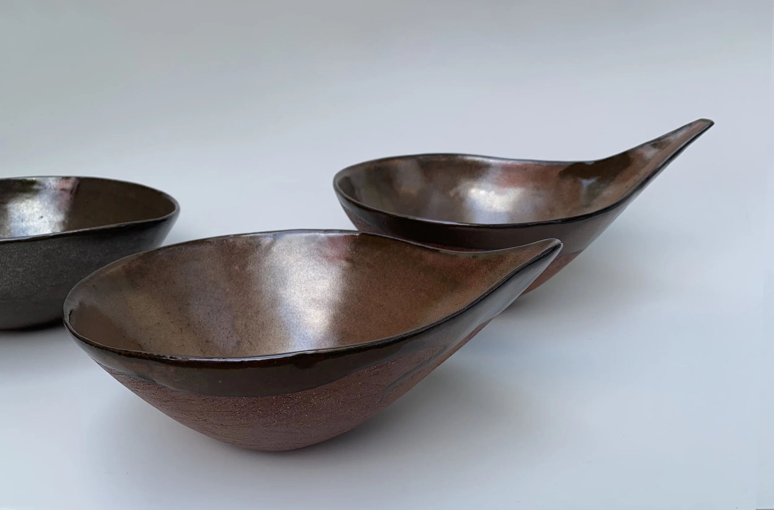 Iron Ladle Bowls. Stoneware. Front: 23cm W x 9.5cm H x 17cm D, Right: 27cm W x 13.5cm H x 18cm D.