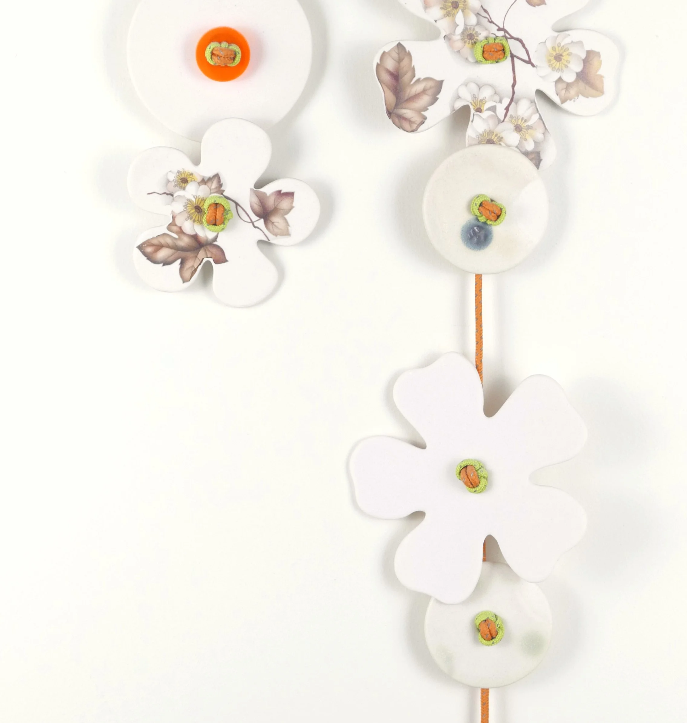 Flora 8. Porcelain, ceramic decals, acrylic, cord. View 1: 60.5cm H x 19cm W.