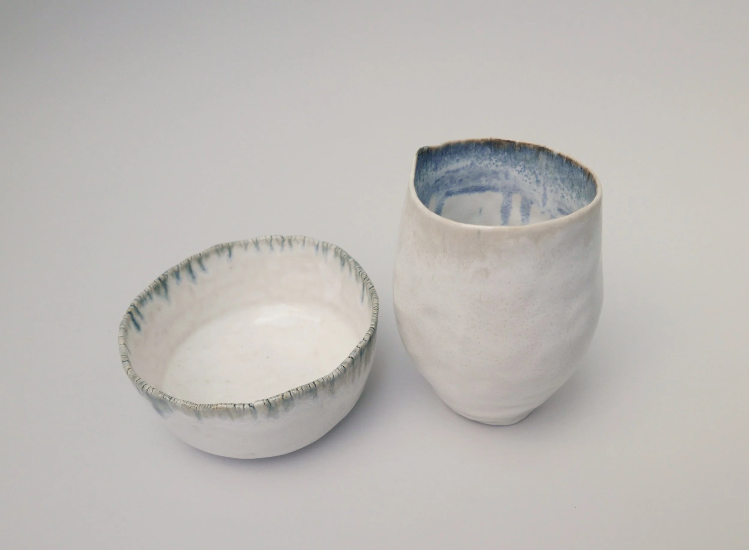 Pinch Pots 6, 7. Porcelain. Left: 13cm W x 6cm H x 12cm D, Right: 9cm W x 13cm H x 9cm D.