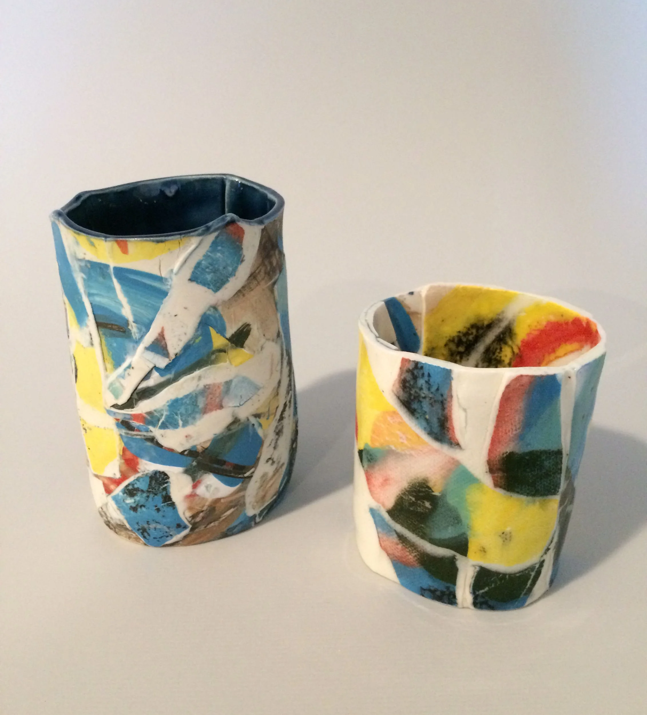 Coloured Cups. Slipcast porcelain. Left: 6cm W x 9.5cm H x 5cm D, Right:7cm W x 7.5cm H x 5cm D.