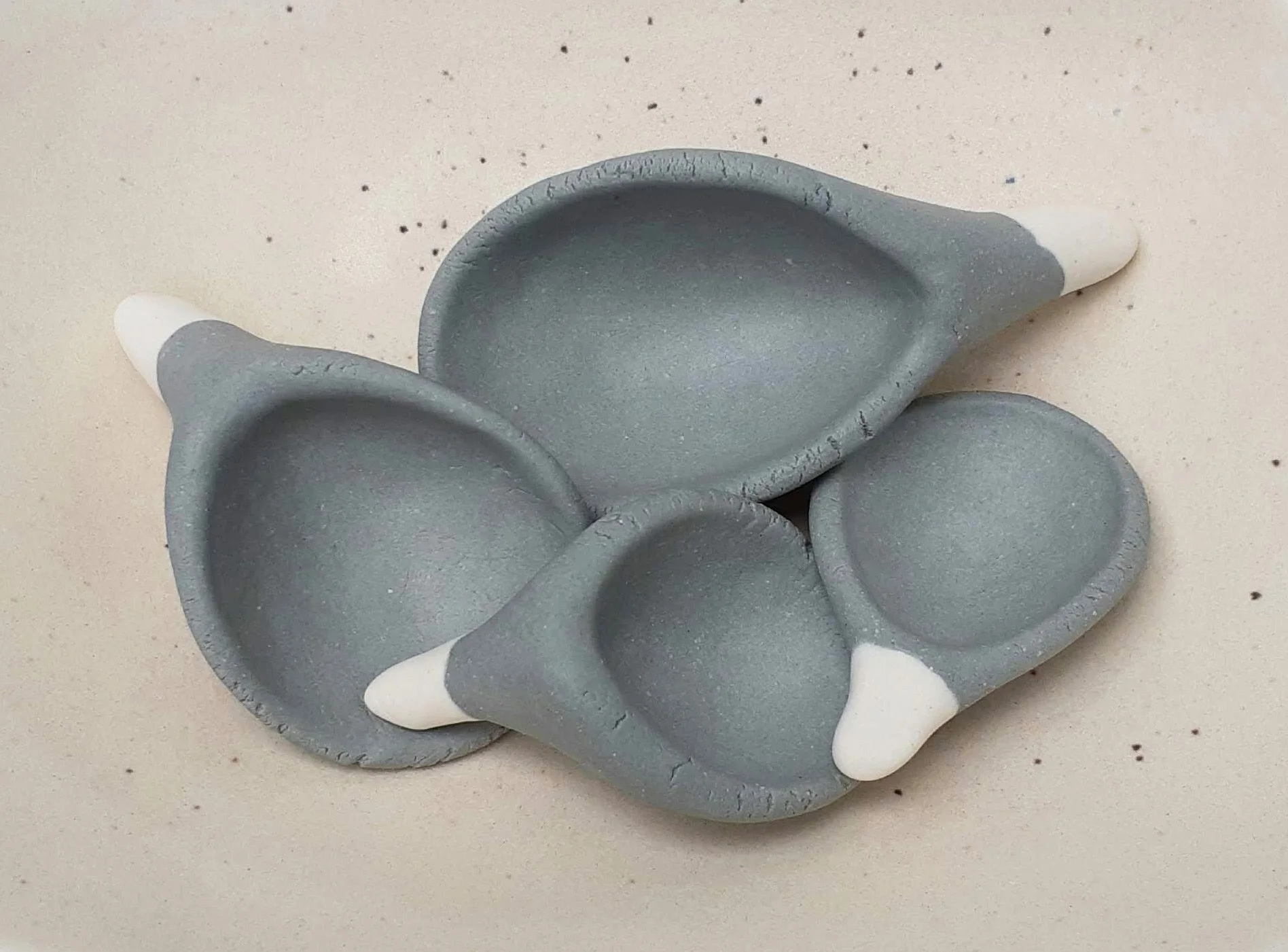 4 Spoons. Porcelain. 19.5cm L x 15.5cm D x 1.5cm H