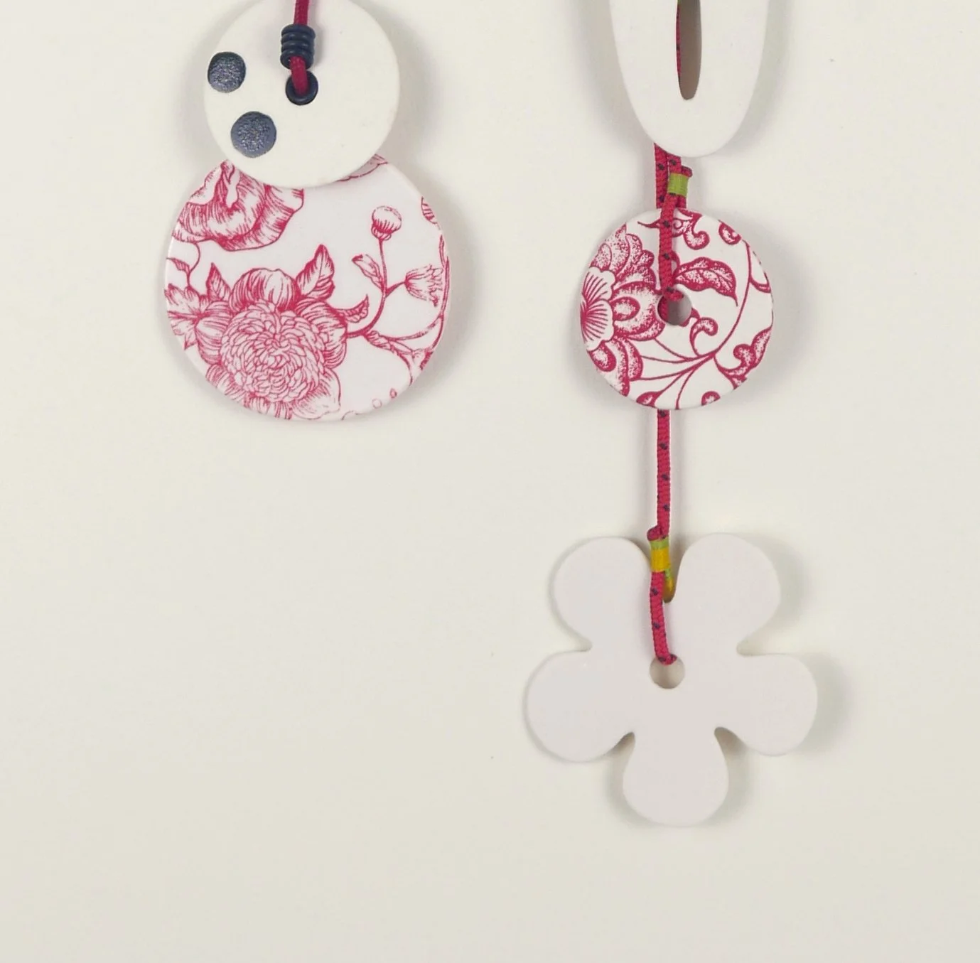 Flora 5. Porcelain, ceramic decals, acrylic, cord. View 1: 43cm H x 21cm W.