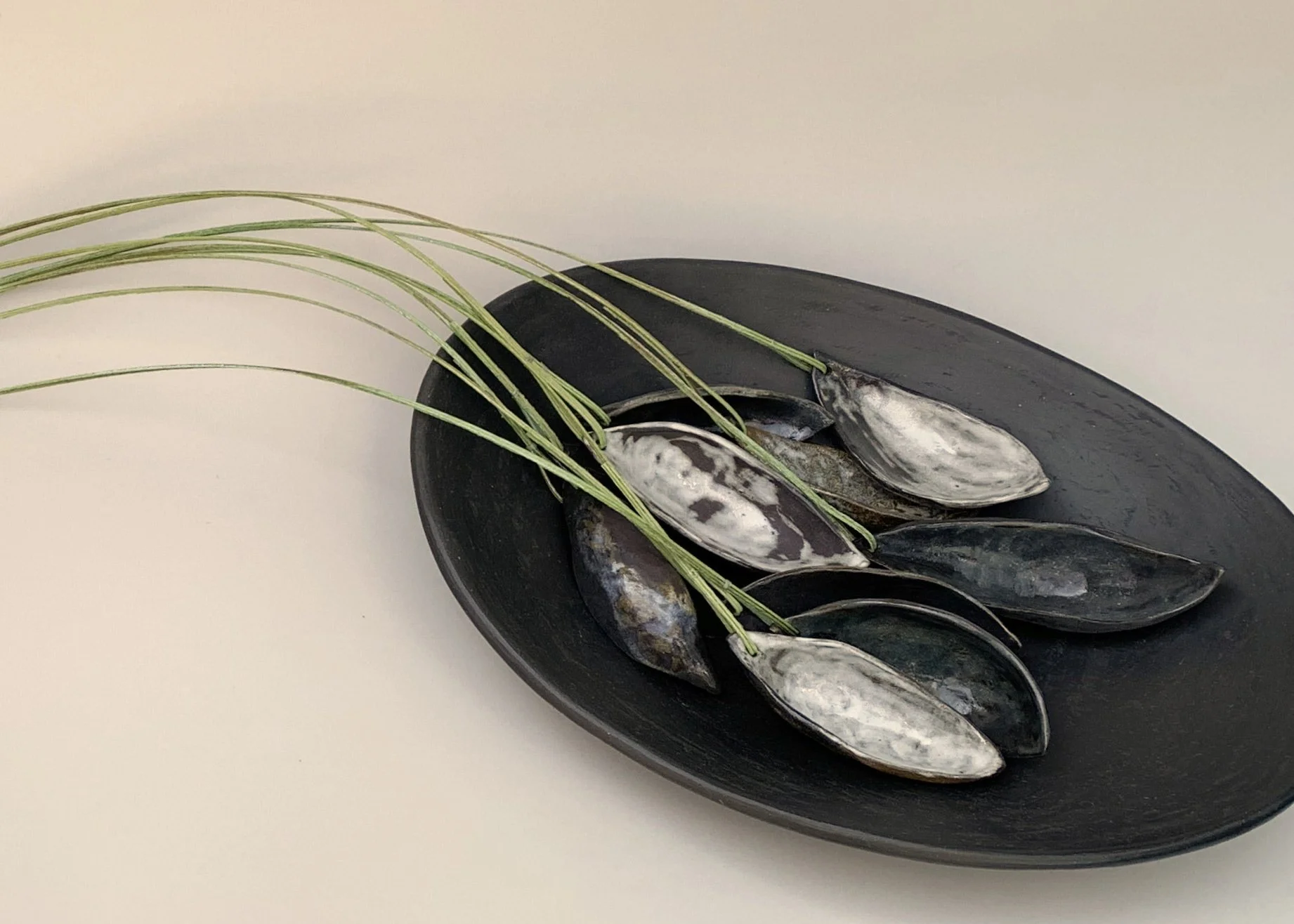 River Pods, Collected, detail. Stoneware, paper. 80cm L x 10cm H x 25cm D