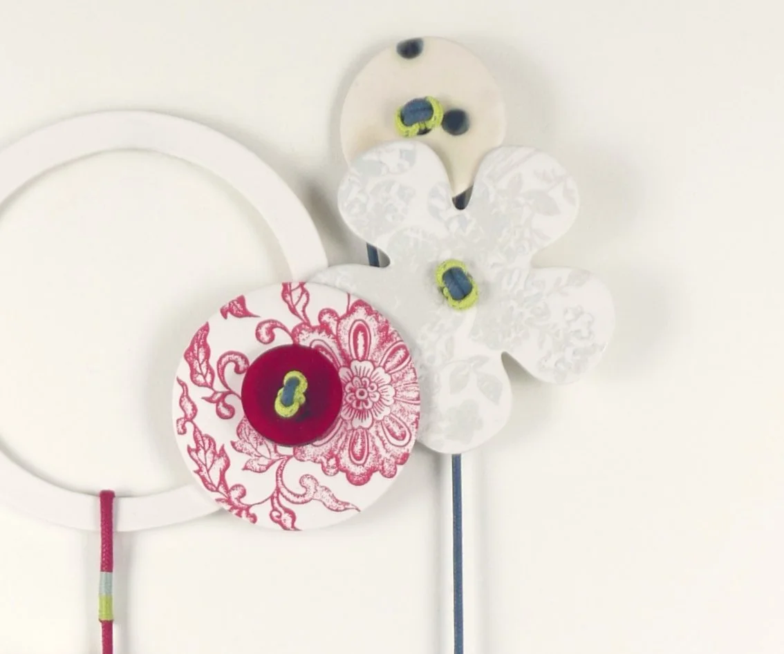 Flora 7. Porcelain, ceramic decals, acrylic, cord. View 1: 53cm H x 20cm W.