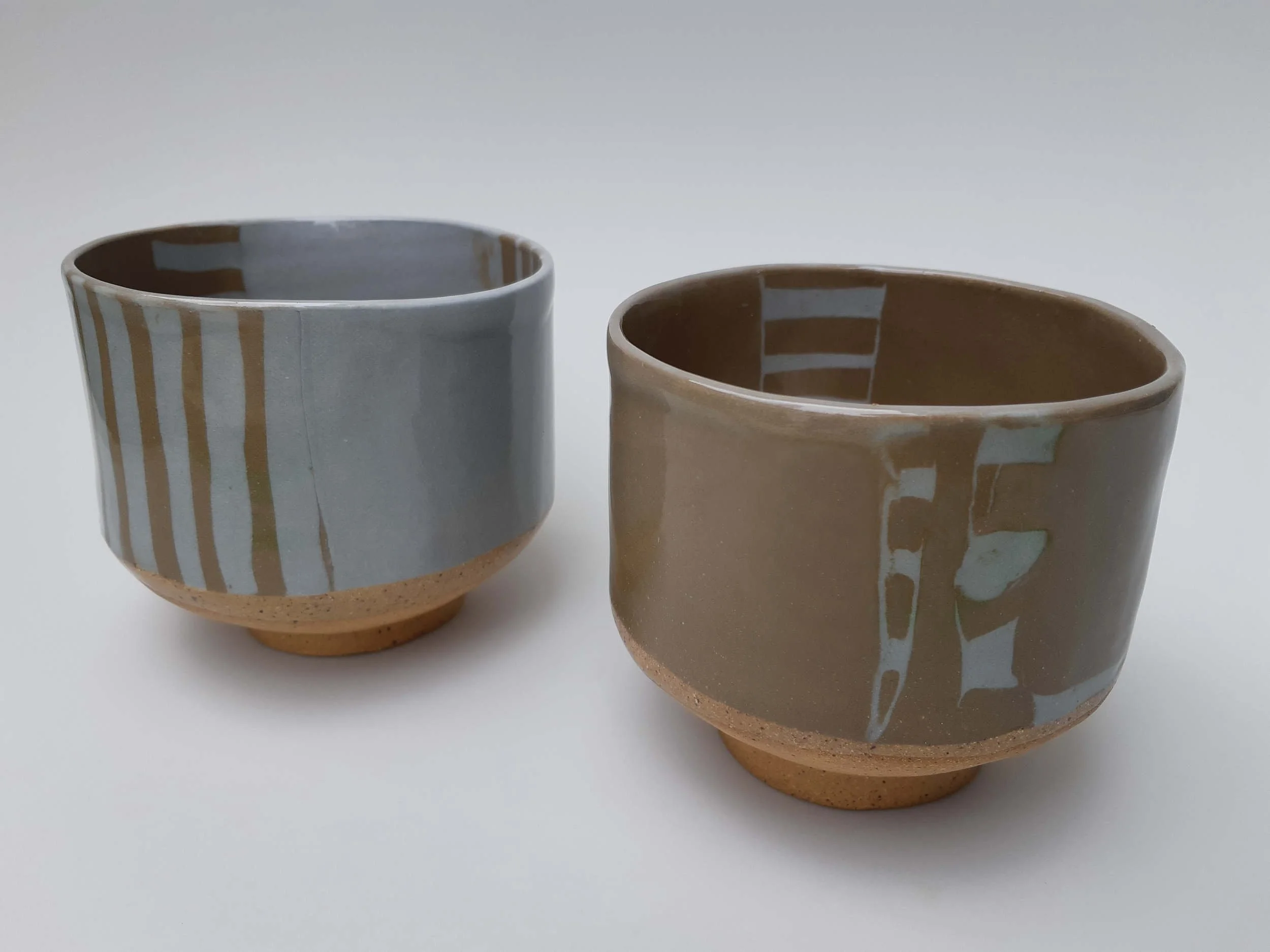 Coloured Clay Small Planters. Stoneware. Left 11.5cm W x 9cm H x 10.5cm D, Right 10cm W x 9cm H x 10cm D.