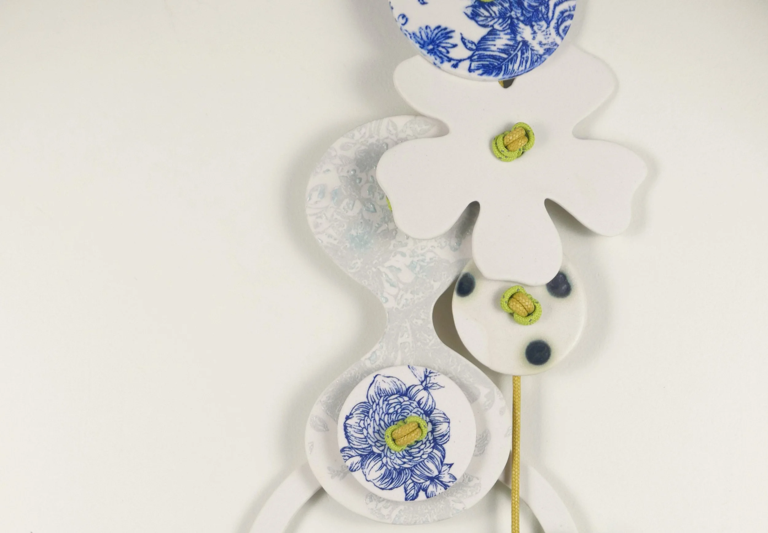 Flora 3. Porcelain, ceramic decals, acrylic, cord. View 3: 35cm H x 15cm W