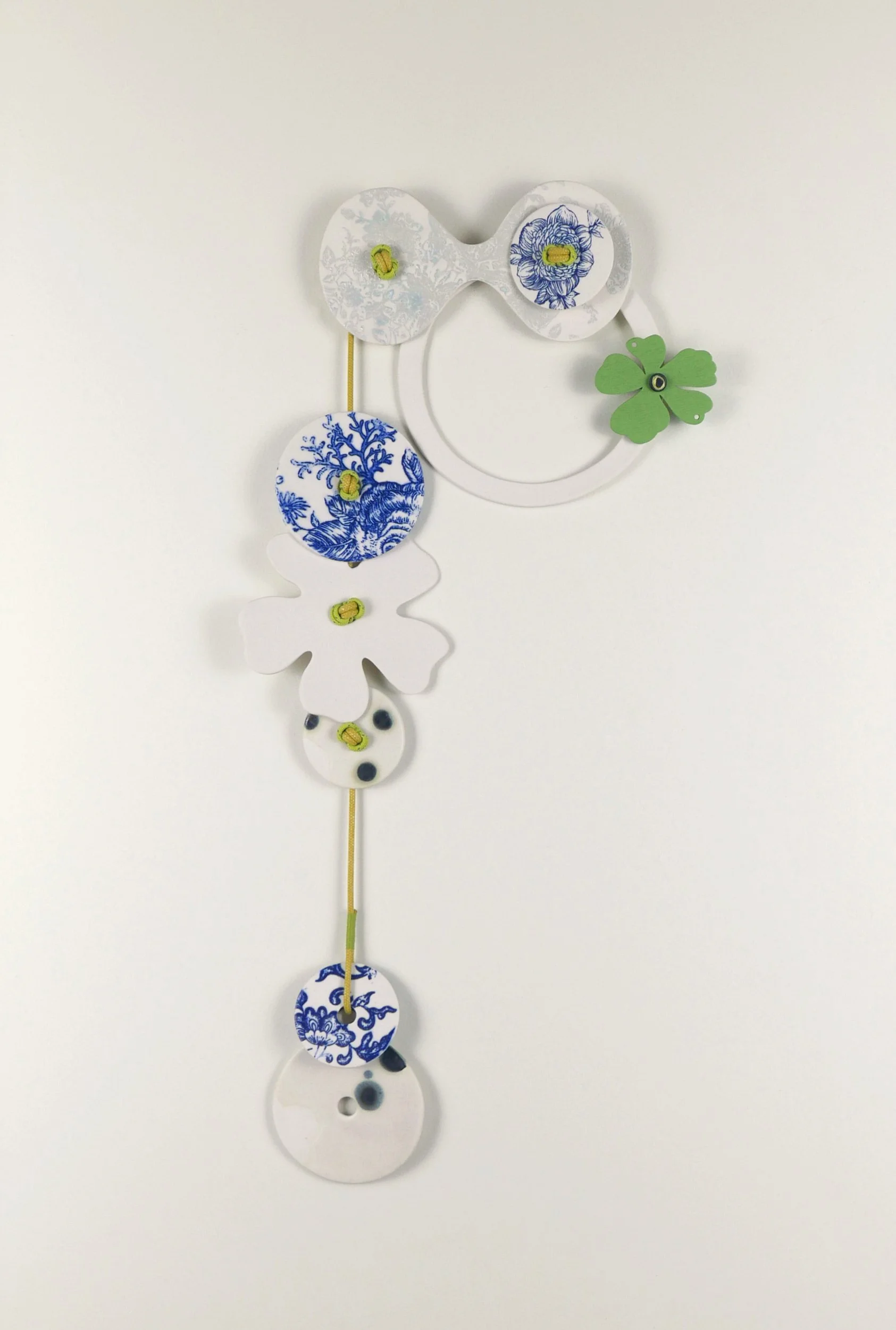 Flora 3. Porcelain, ceramic decals, acrylic, cord. View 1: 41cm H x 22cm W.