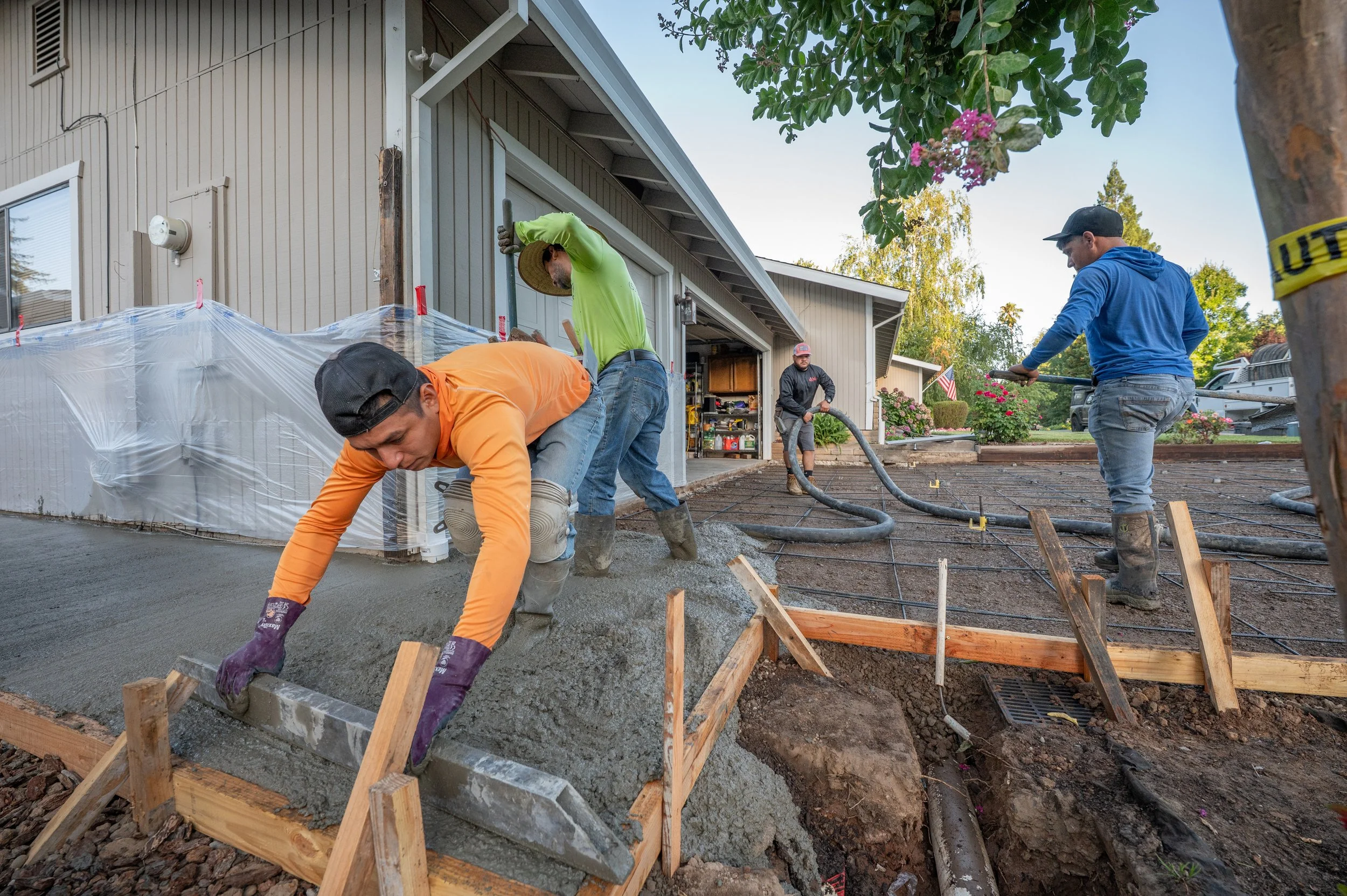 Wolves Builders crew preparing reinforced concrete foundation forms.