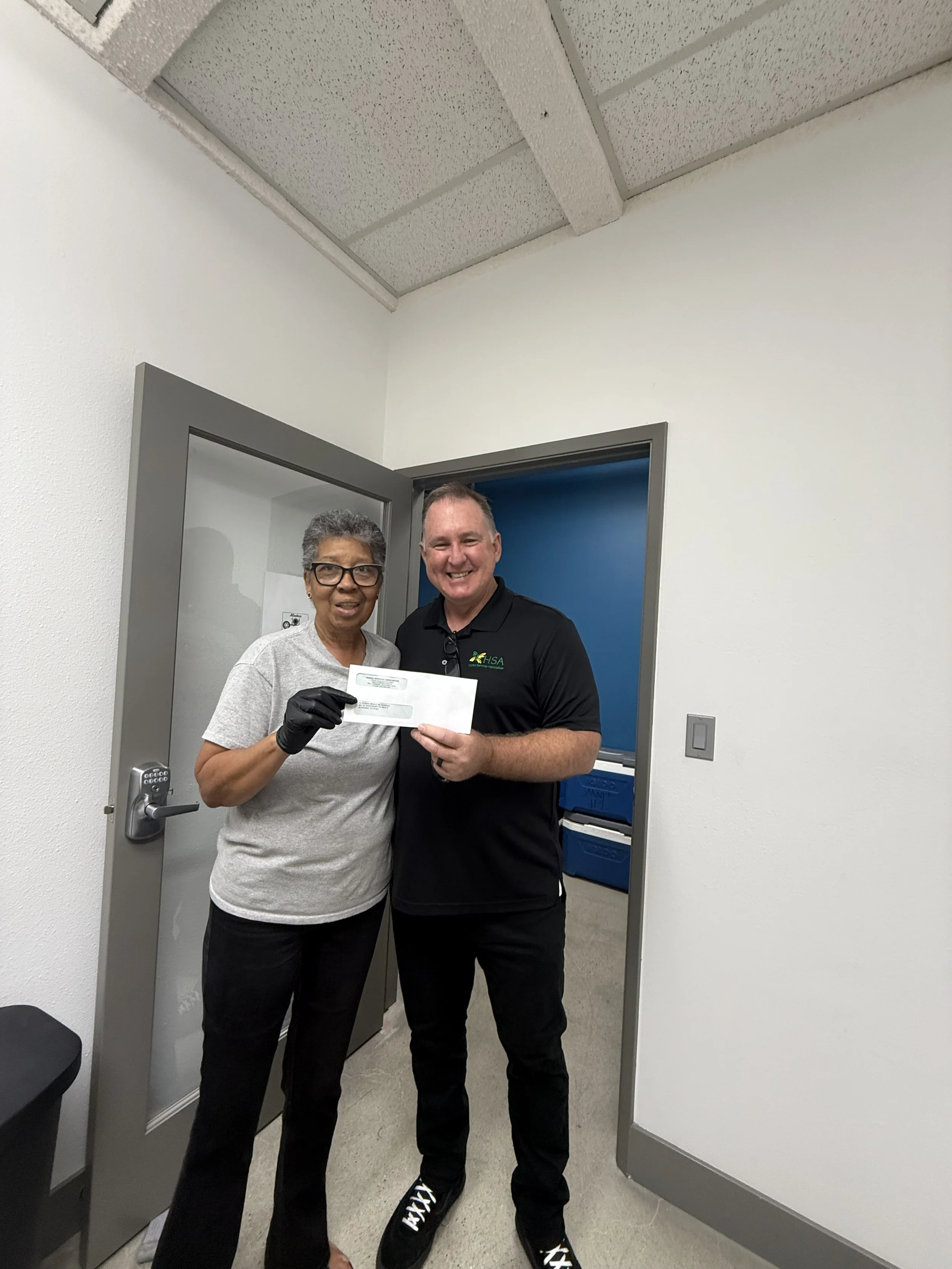 Board Member Receiving a Donation