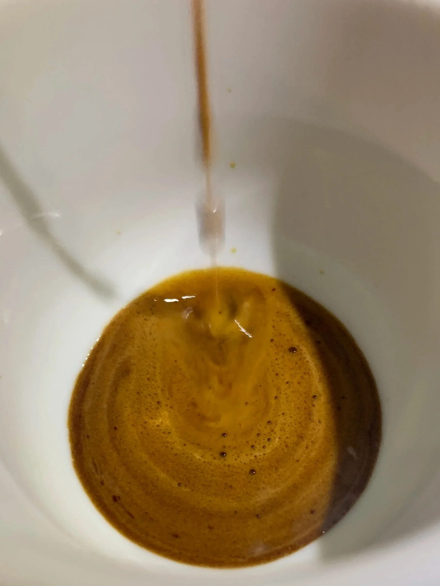 Espresso being extracted for a double macchiato prepared by Daniel Karl Nennig.