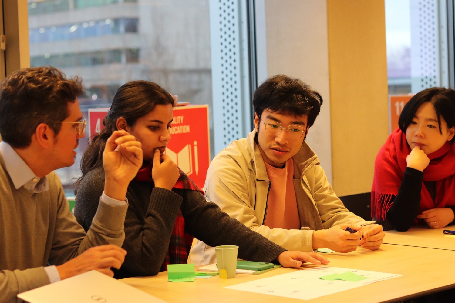 Participants working on a problem together at a table