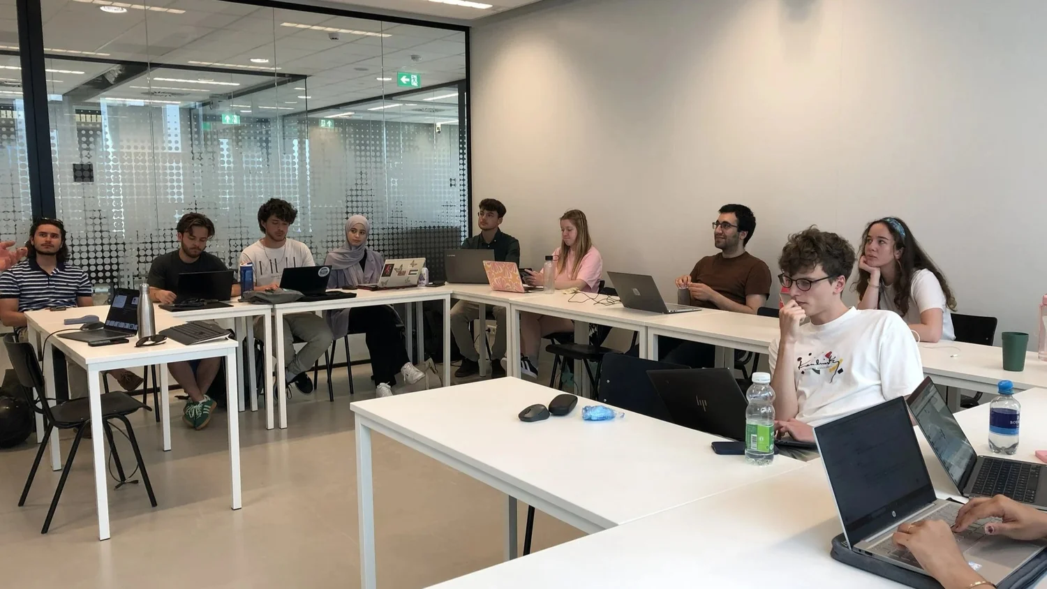 Students with laptops in the GenAI course