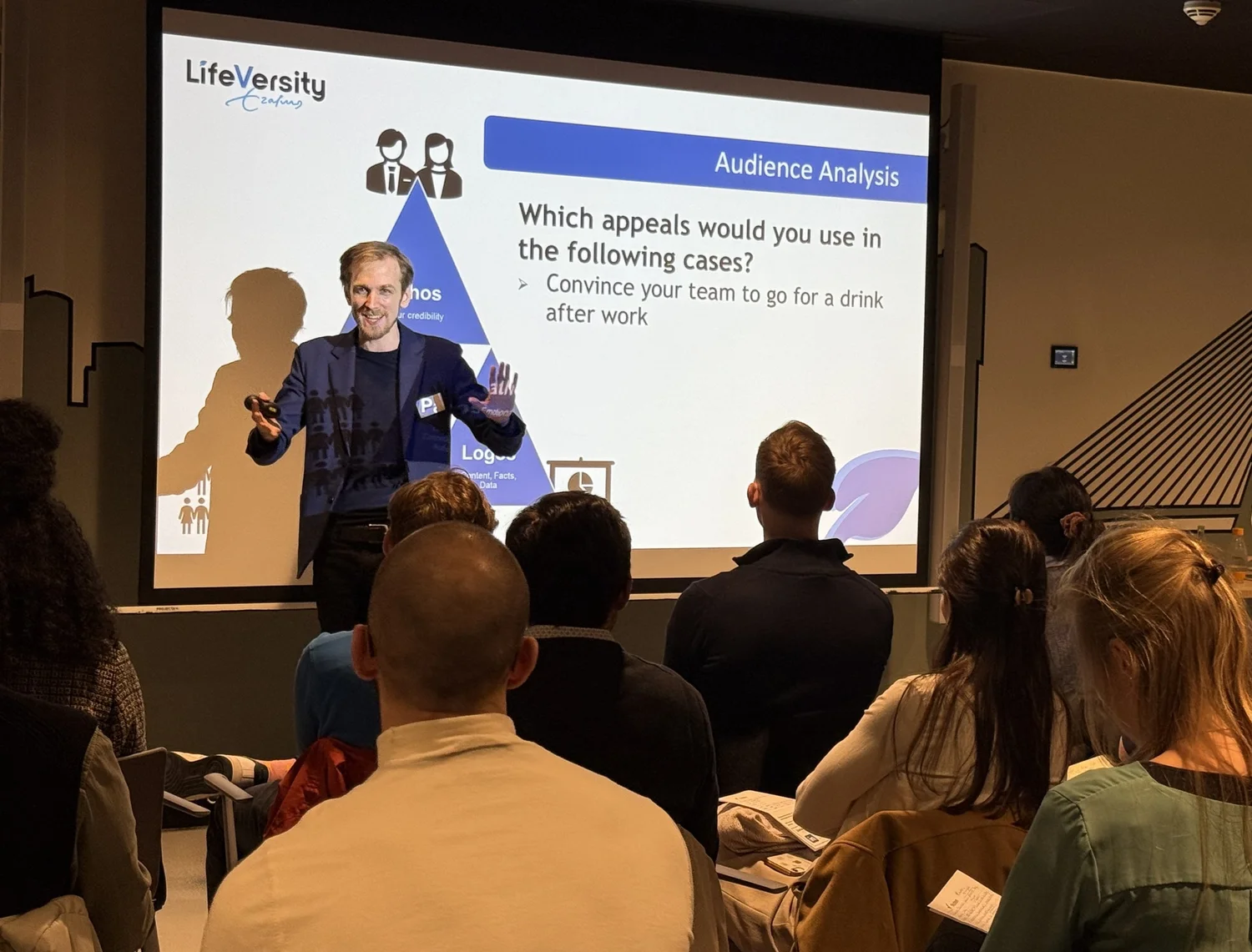 Matt teaching audience analysis in front of a slide