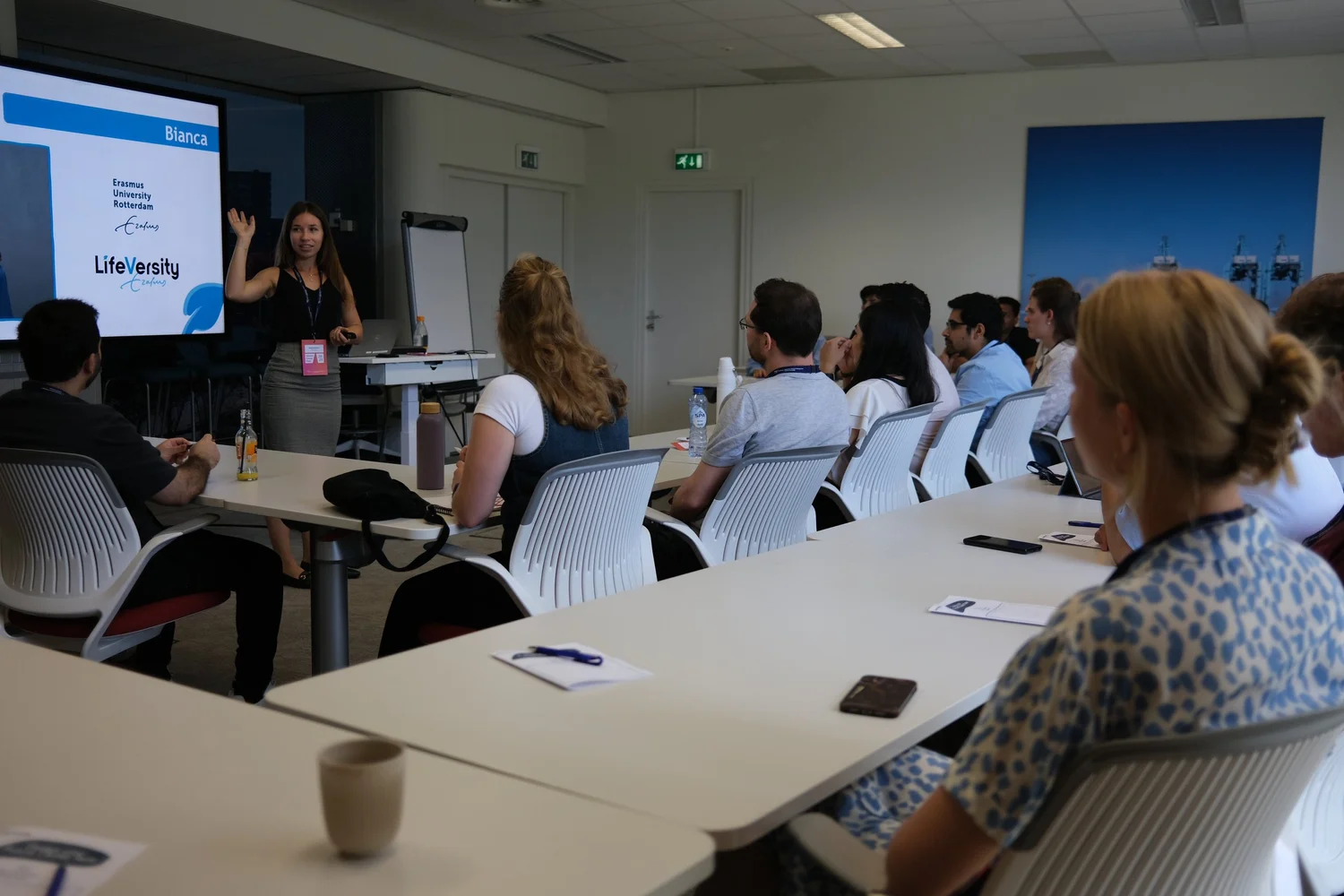 Professionals seated at tables during a LifeVersity session