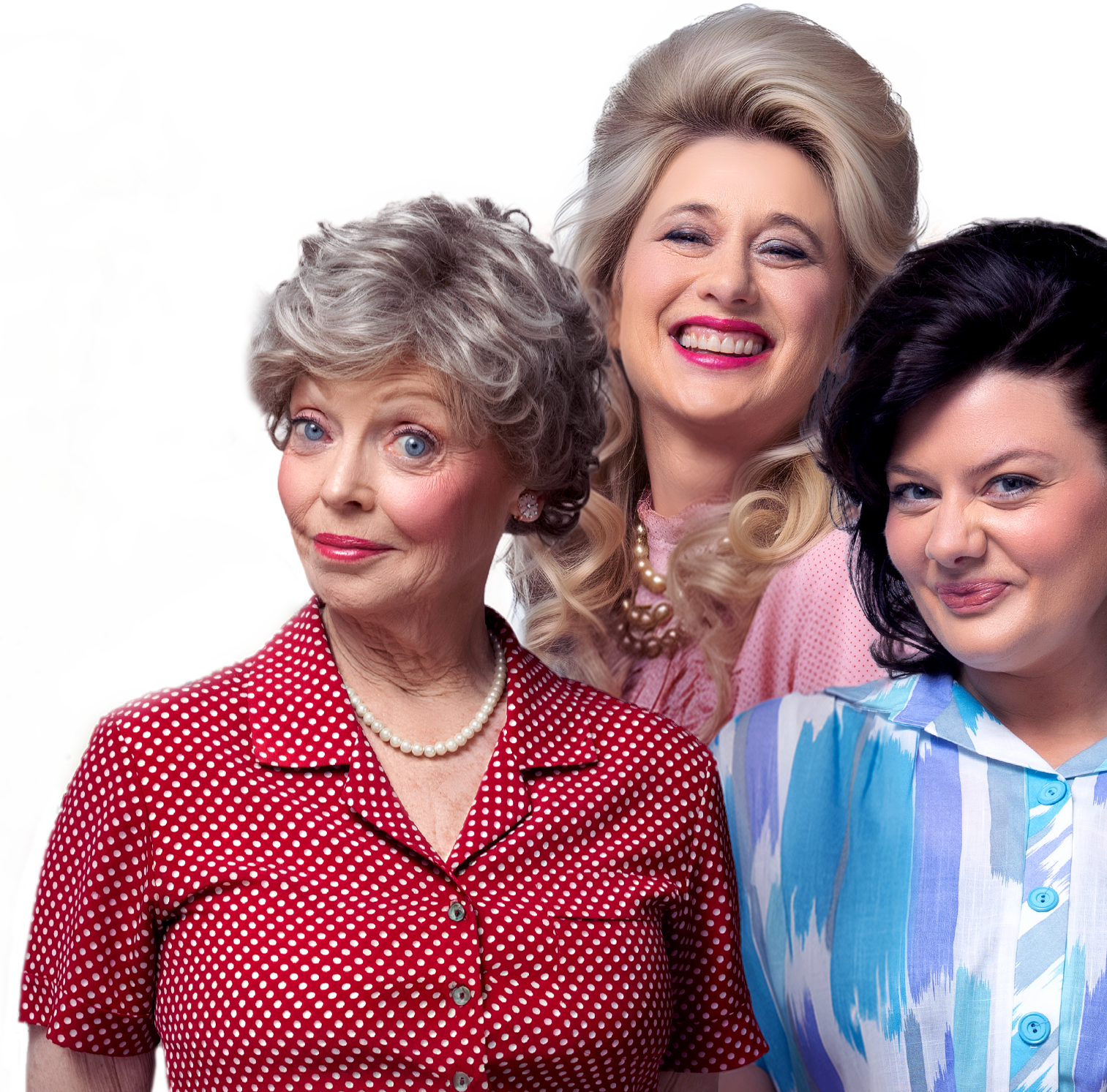 Four women in colorful vintage-style outfits smiling and posing together.