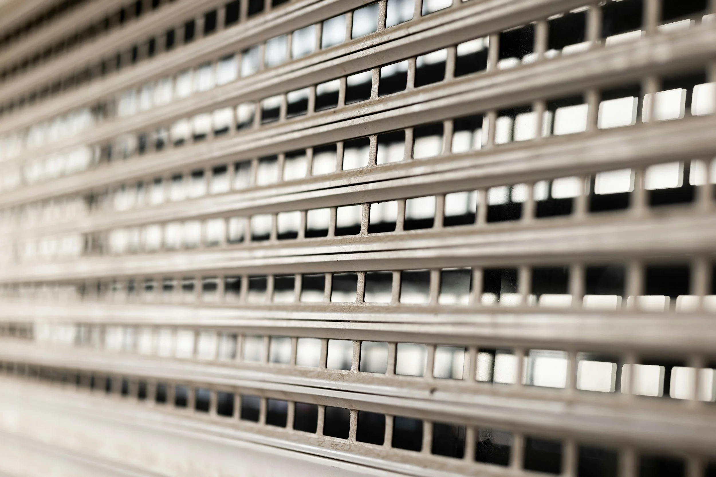 Close-up of a metallic rolling shutter with horizontal slats.