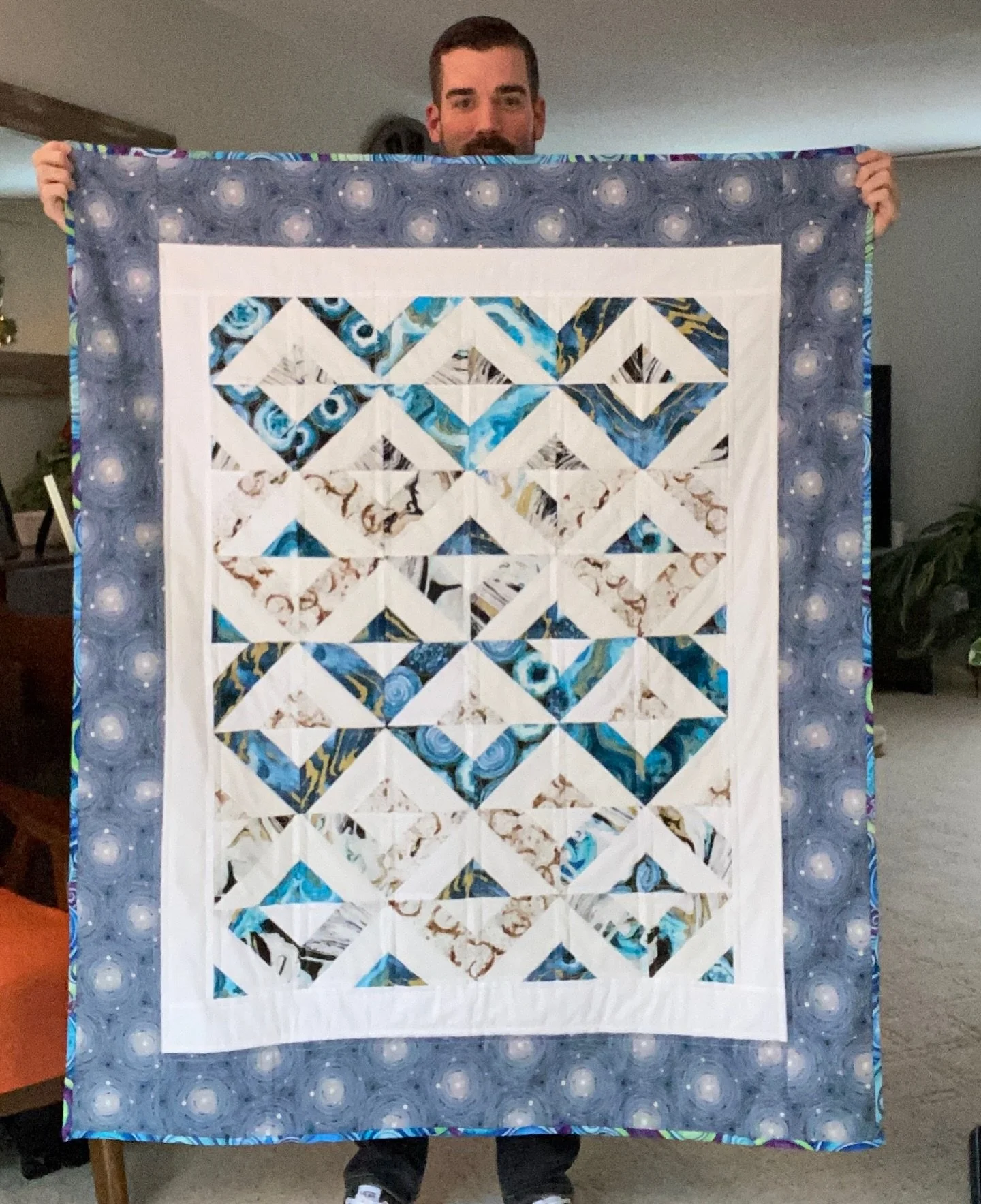 While I managed to piece and quilt several table runners as well as finish some of the inherited unfinished projects, the first quilt I ever actually made from start to finish was a baby quilt I started it in early 2021. I followed a pattern called S