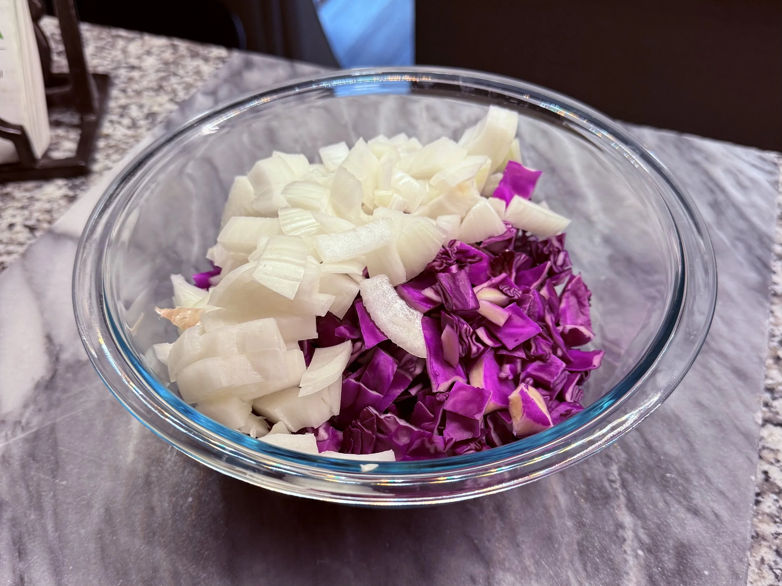 Prepare the red cabbage and onion by dicing.