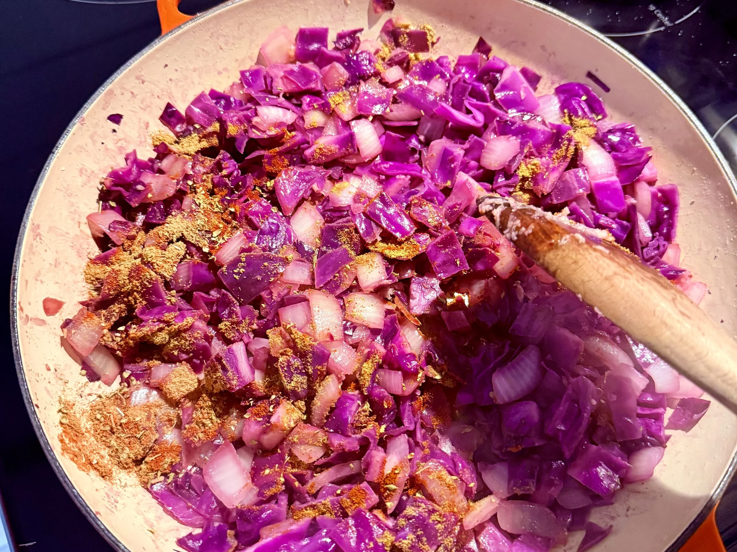 Add spices to cabbage and onion mixture