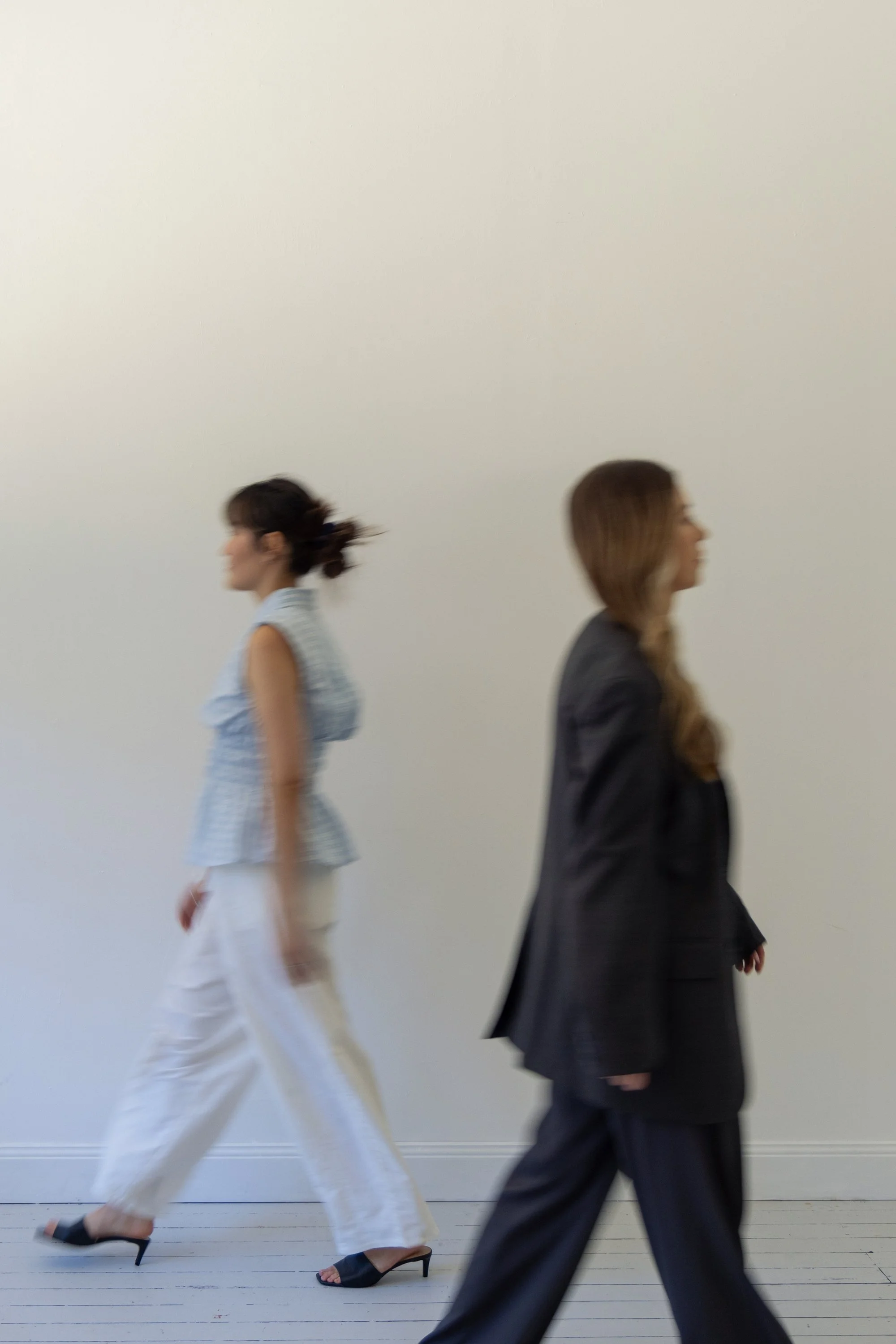 Two employees walking in marketing studio