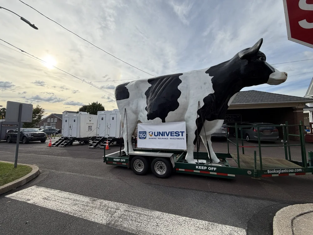 Two restroom trailers at a sponsored community event