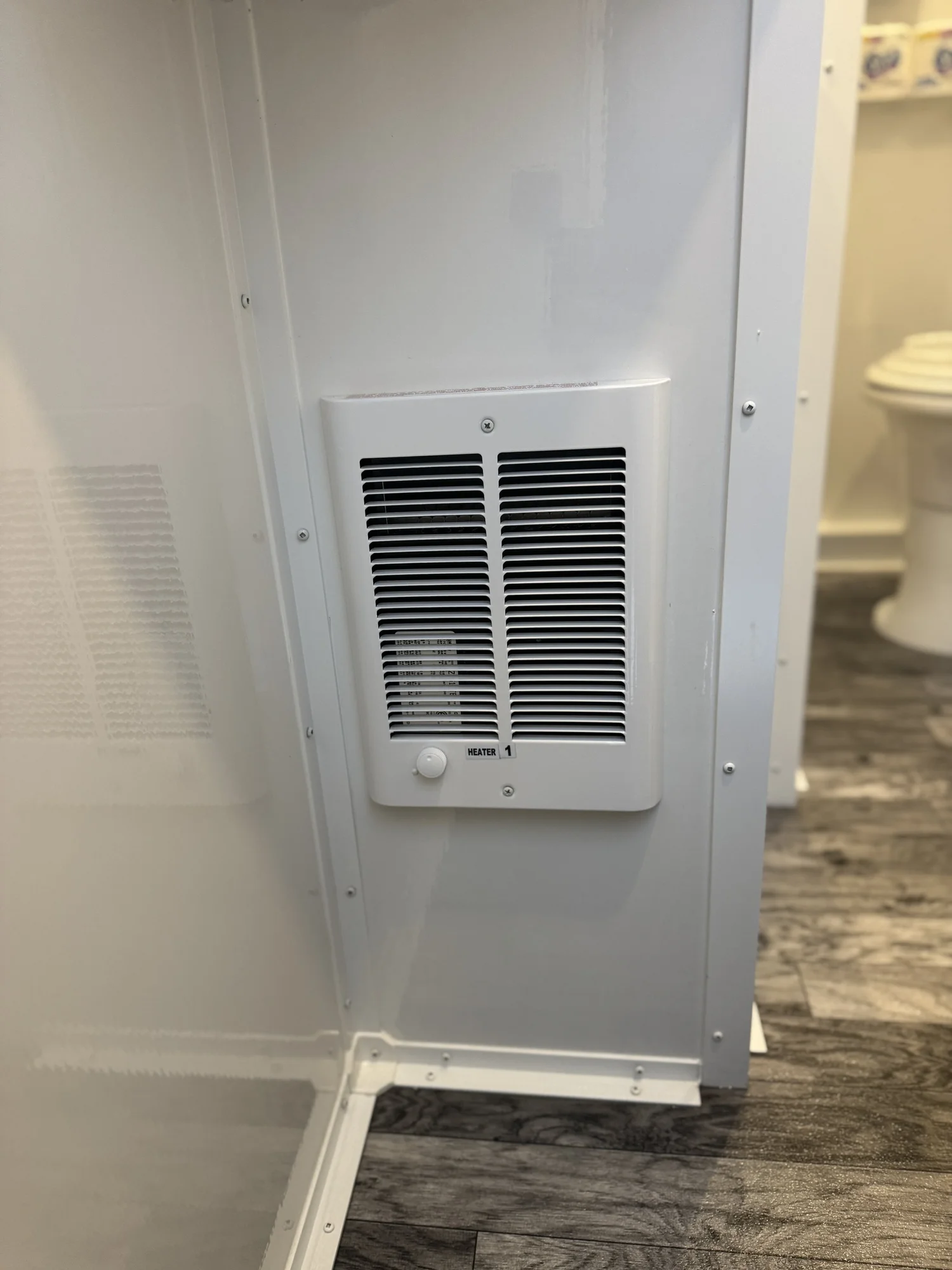 Wide view of climate-controlled restroom trailer interior