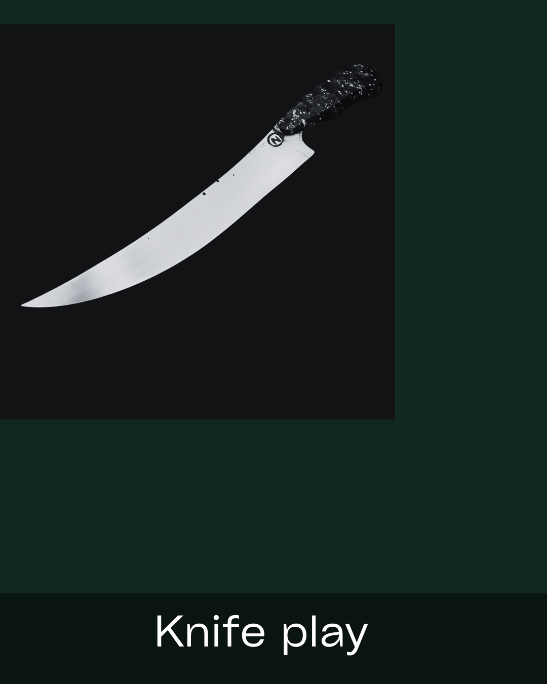 A curved chef's knife with a black textured handle on a black background, labeled 'Knife play'.