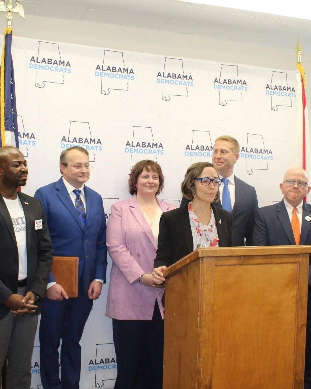 democrat signing at podium.jpg