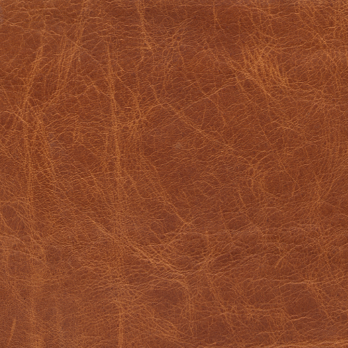 Close-up of a brown leather surface with visible texture and grain.