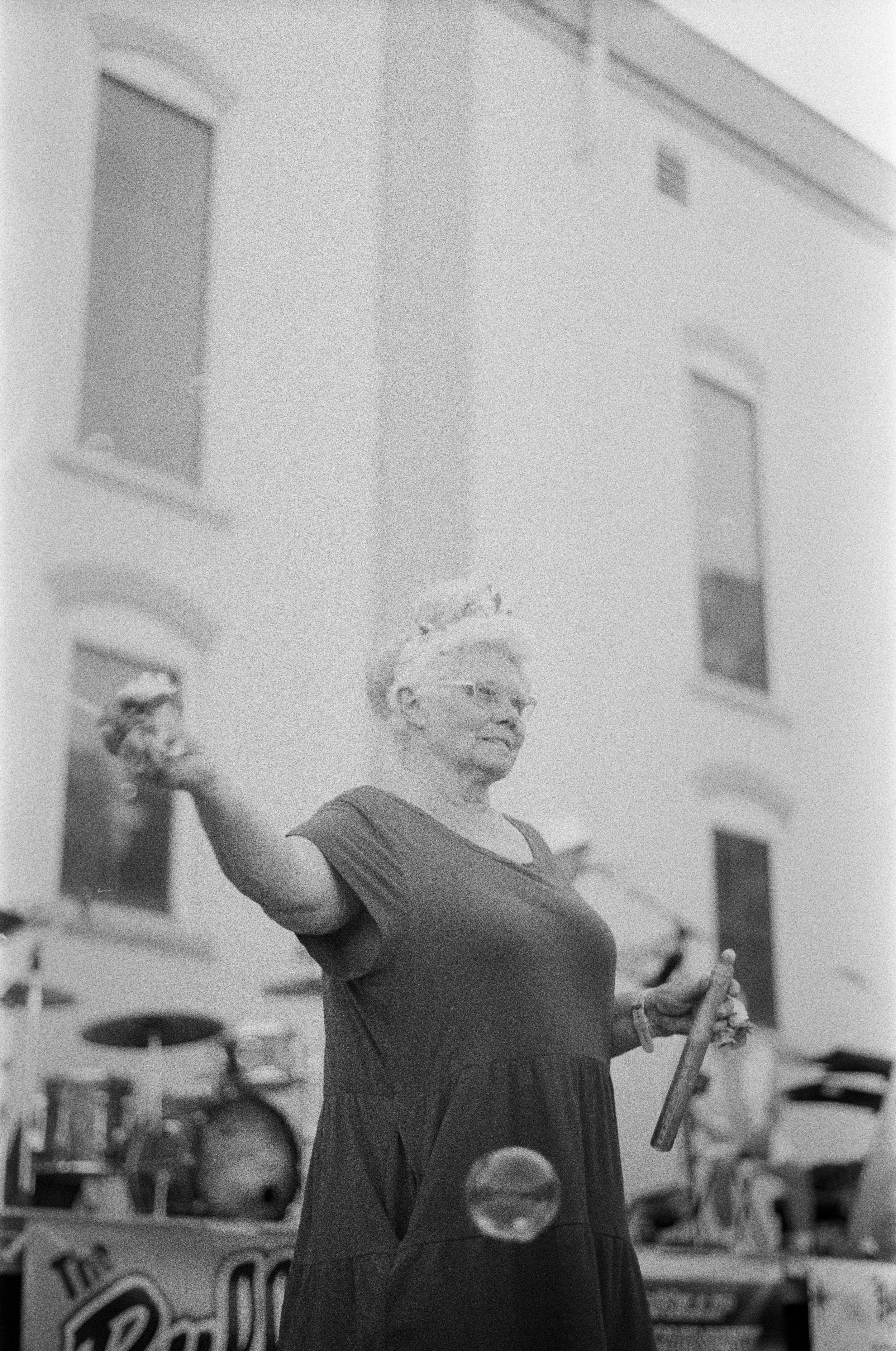 The woman who dances downtown. July 4th, 2025. Downtown first friday. Fuji 400 Film