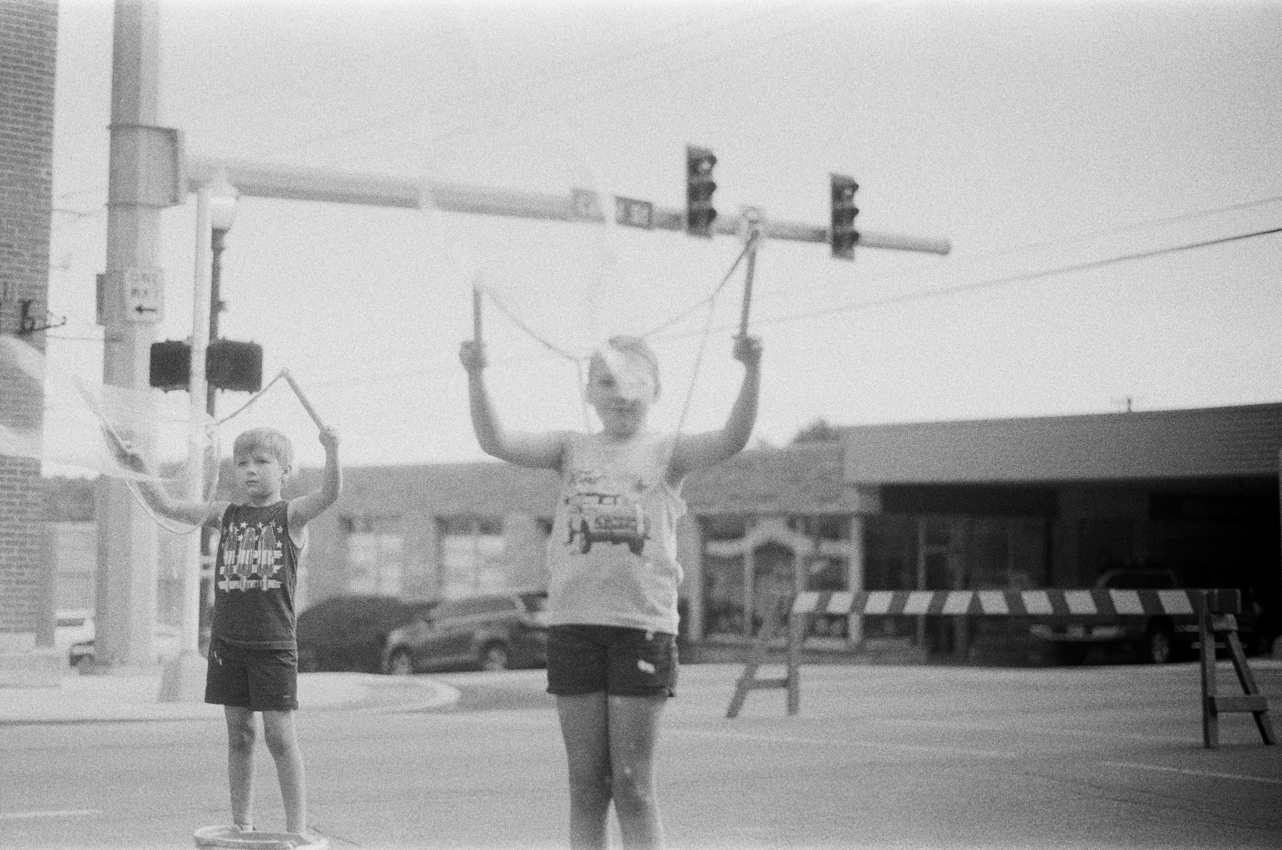July 4th, 2025 First Friday - Local children blowing bubbles with strings. Fuji 400 Film. 