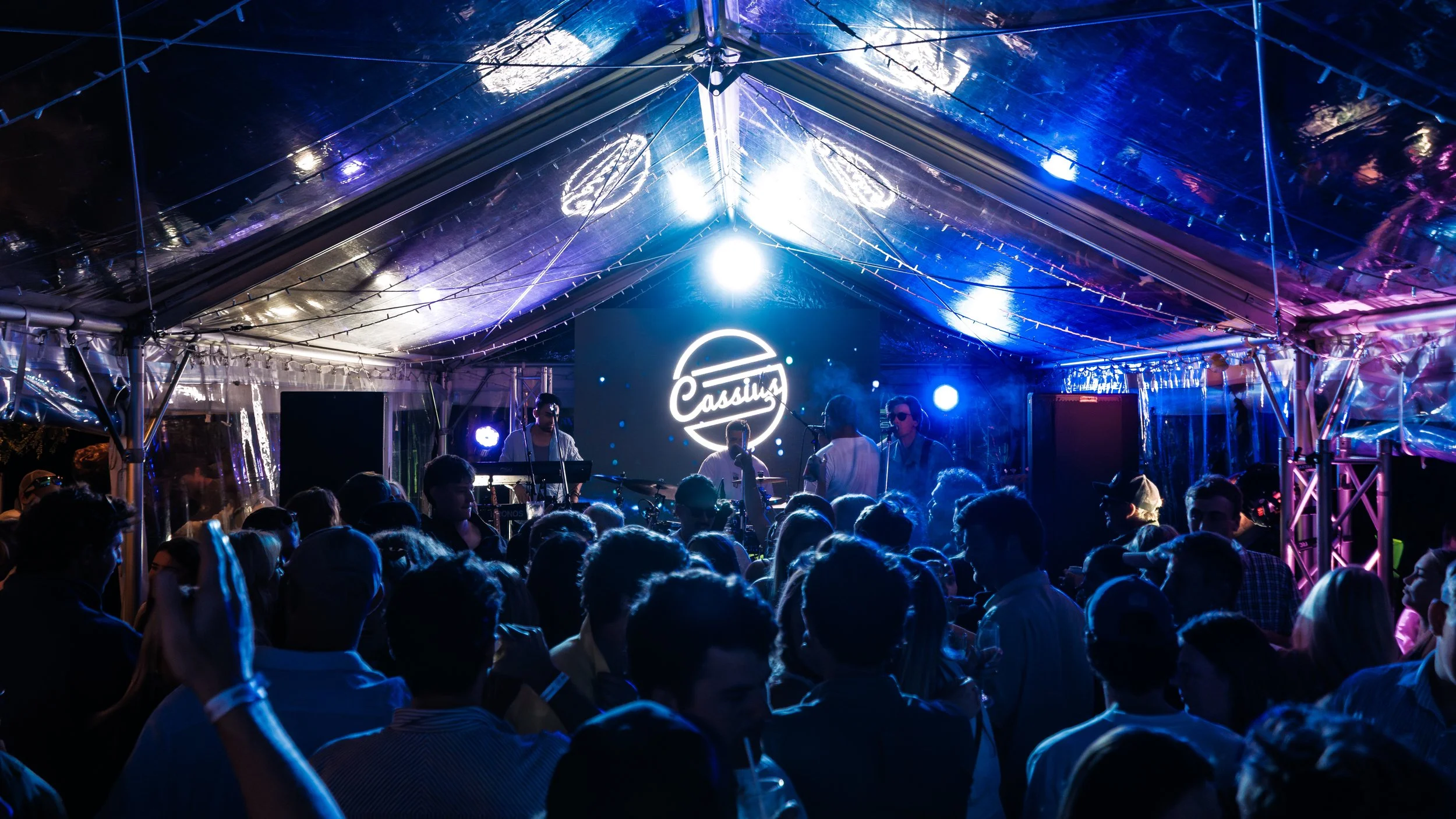 People celebrating New Year's with fireworks over a body of water at night, with text overlay that reads 'New Year's Party 2MILE2TWENTY-SIX'.